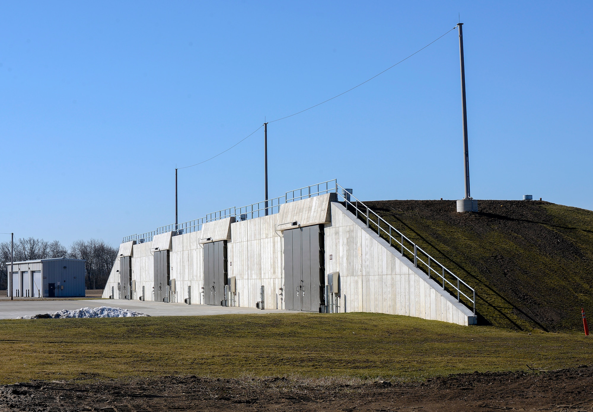 One of the 88th Operations Support Squadron Munitions Flight explosives-storage igloos is pictured March 3, 2021 at Wright-Patterson Air Force Base, Ohio. In 2020, six new facilities replaced six old ones, which increased the unit’s explosive weight-storage capacity by more than 175,000 pounds and reduced the structure footprint by 25 percent. (U.S. Air Force photo by Ty Greenlees)