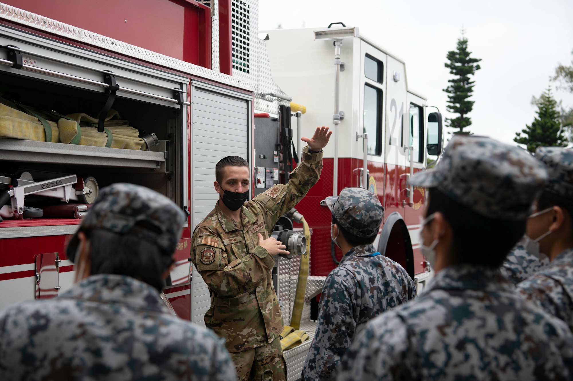 18th CES Airman briefs JASDF firefighters.