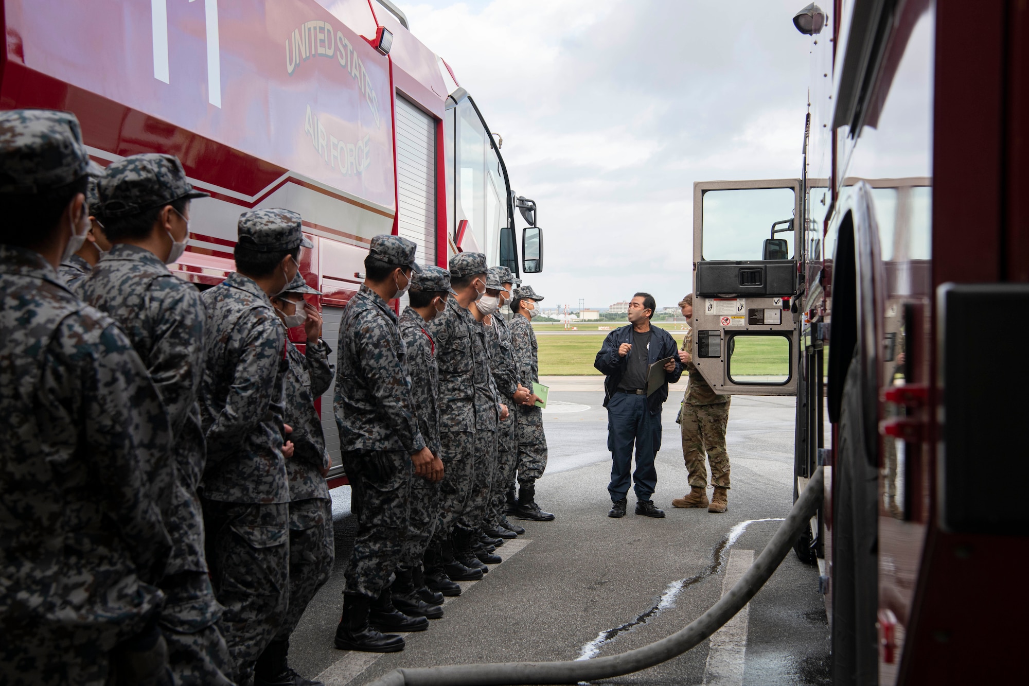 18th CES member briefs JASDF firefighters.