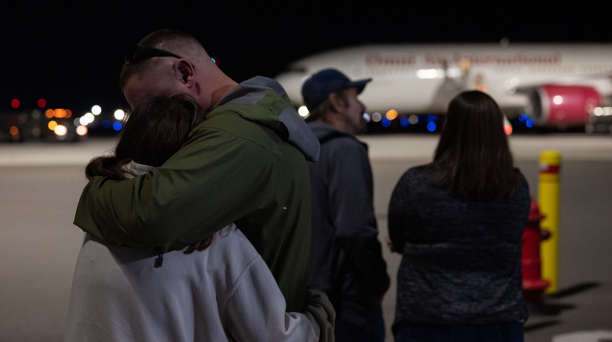 A member of the Nevada Air National Guard embraces a loved one on the flight line prior to departing for a deployment at the Nevada Air National Guard Base, Reno, Nevada.