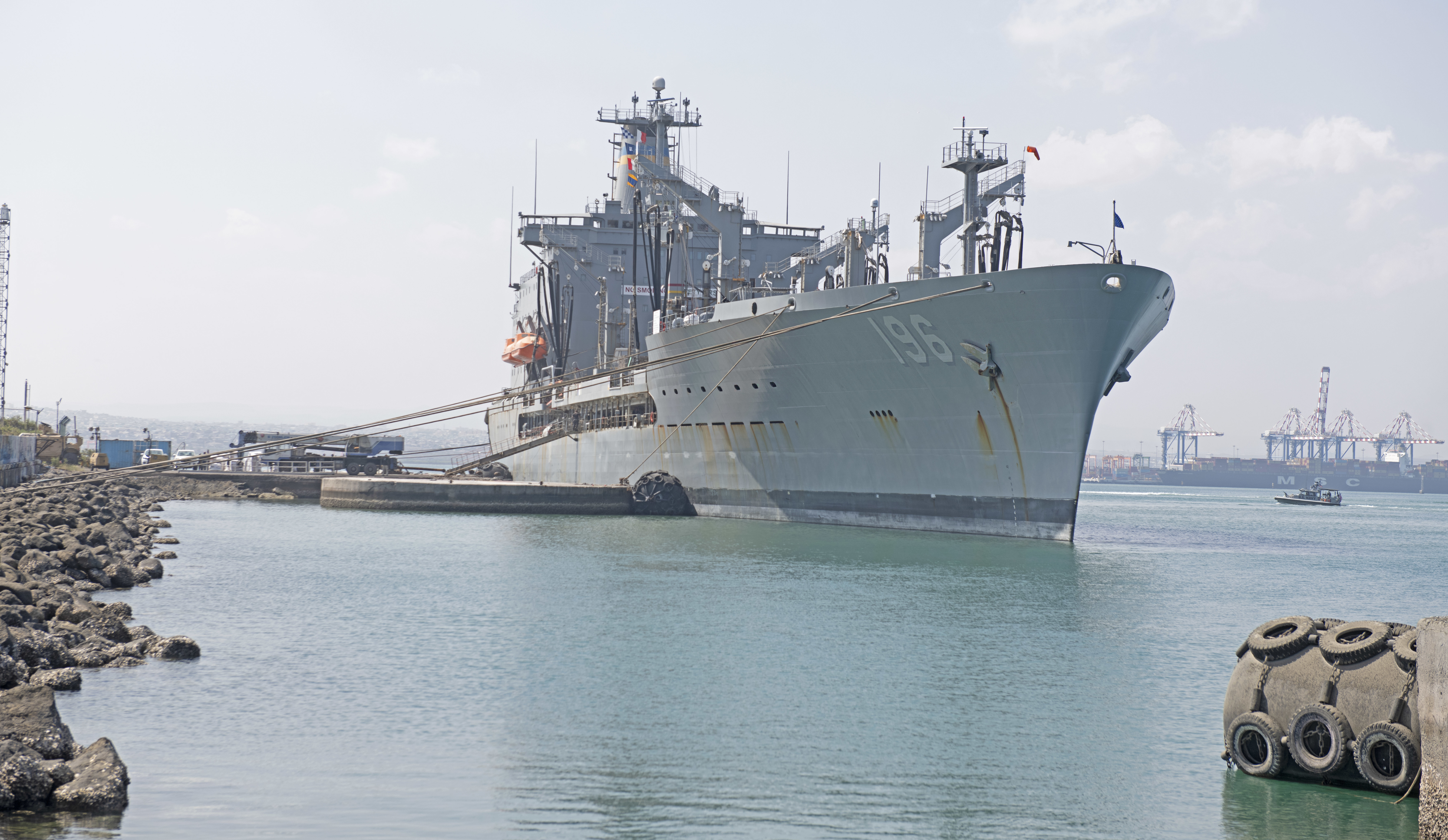 The Henry J. Kaiser-class fleet replenishment oiler USNS Kanawha (T-AO-196) sits pier side during a sustainment and logistics visit at the Port of Djibouti.