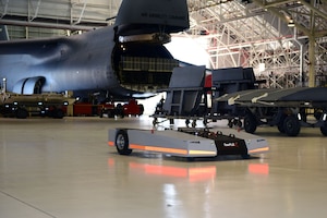 A TowFLEXX 5.4, (TF-5), tug maneuvers through Building 125 at Robins Air Force Base, Ga., Sept. 18, 2019. The TF-5 is a low profile aircraft positioner tug/tractor that can turn 360 degrees and is able to move an F-15 Eagle aircraft in a 65-foot circle.