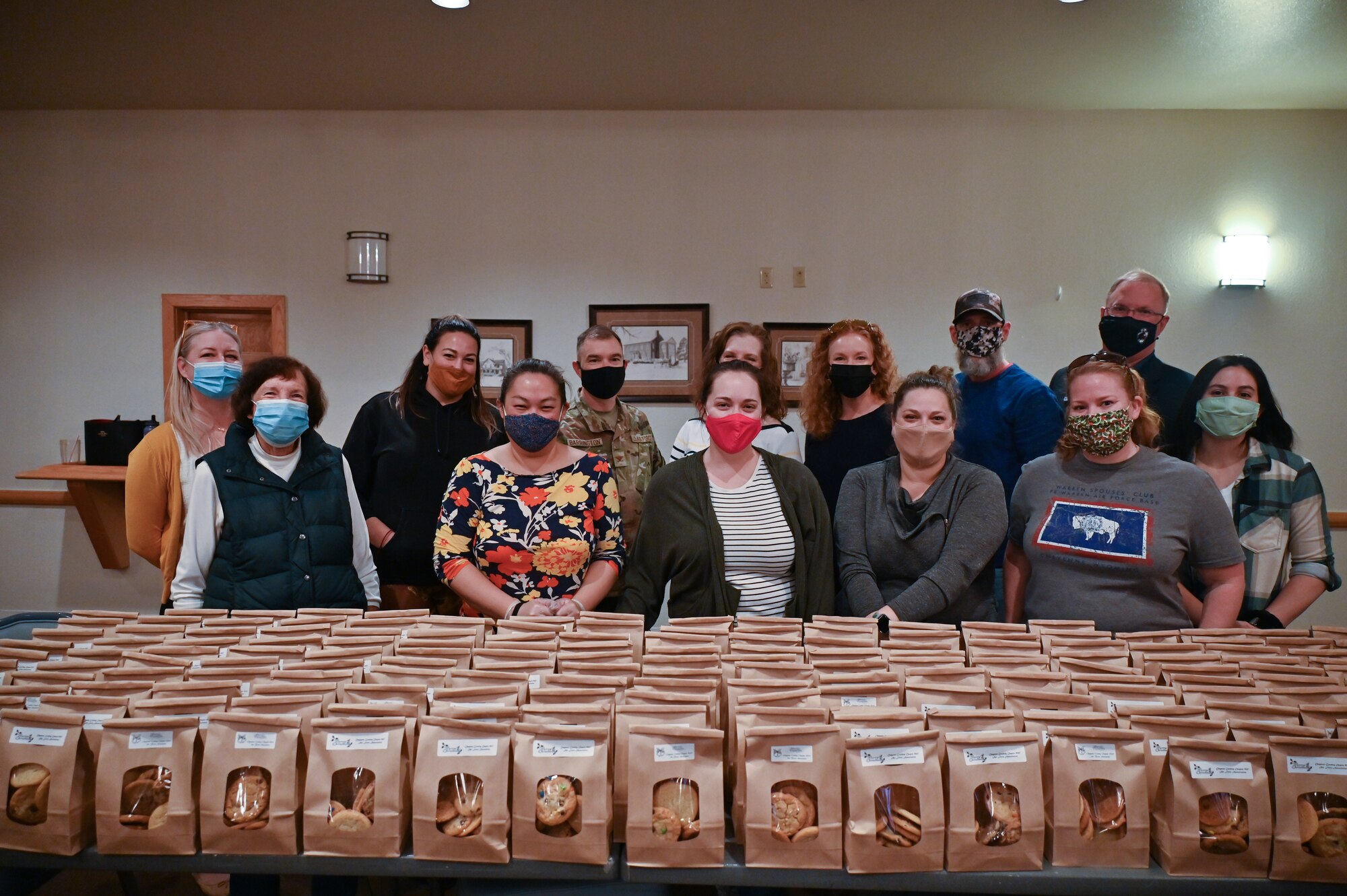 The Air Force Association Cowboy Chapter, Warren Spouses’ Club, Albertsons, base first sergeants, 90th Missile Wing Airman and Family Readiness Center and other community organizations joined together to deliver more than 500 dozen cookies to Airmen and families on F.E. Warren Air Force Base, Wyoming, Dec. 2, 2021. The Cheyenne community came together to spread some holiday cheer for Airmen and families of deployed members for the Air Force Association Cowboy Chapter’s Annual Cookie Drive. (U.S. Air Force photos by Joseph Coslett)