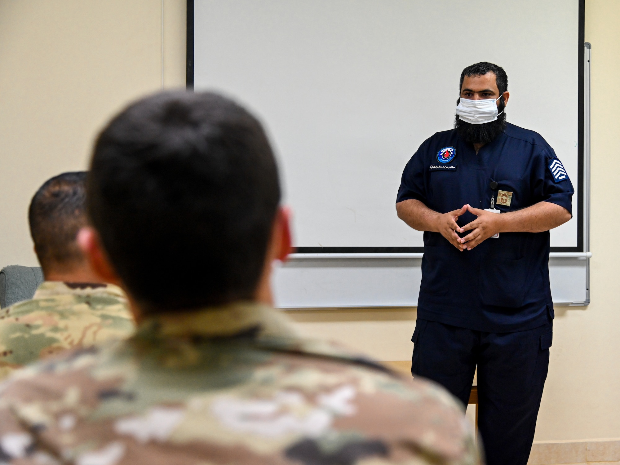 Chief Salem al Shakrh, Royal Saudi Air Force fire chief, briefs members of the 378th Expeditionary Civil Engineer Squadron fire department during an integrated training at Prince Sultan Air Base, Kingdom of Saudi Arabia, Nov. 24, 2021. The briefing allowed members of the 378 ECES to gain a better understanding of the role that the RSAF fire department plays within the mission of the 378th Air Expeditionary Wing. (U.S. Air Force photo by Staff Sgt. Christina Graves)