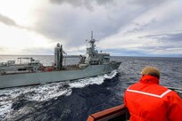 Cdr. Christopher Petro, commanding officer onboard the Arleigh Burke-class guided-missile destroyer USS Porter (DDG 78), supervises as part of a replenishment-at-sea (RAS) with the Spanish replenishment ship ESPS Cantabria (A 15) during Exercise Polaris on Patrol 10, Nov. 29, 2021.