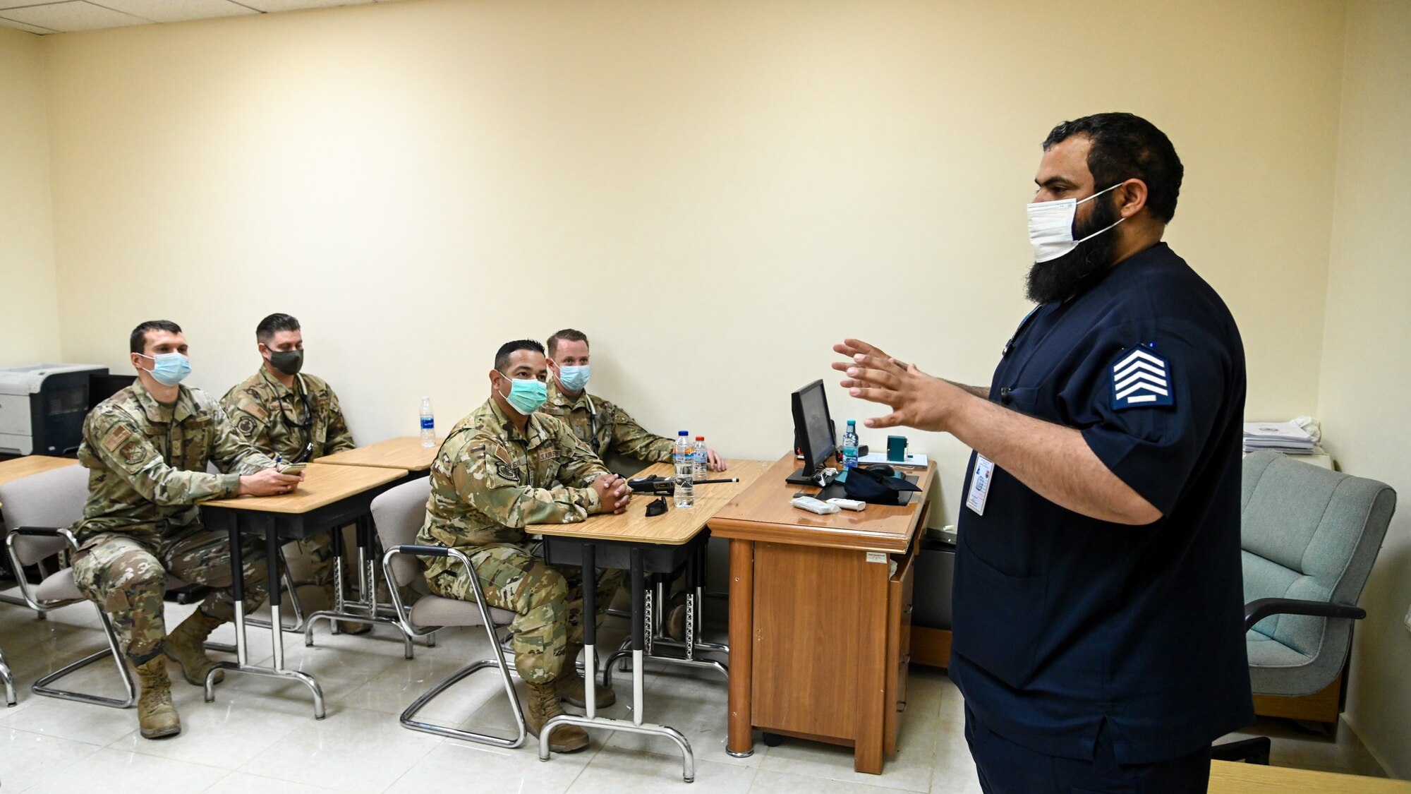Chief Salem al Shakrh, Royal Saudi Air Force fire chief, briefs members of the 378th Expeditionary Civil Engineer Squadron fire department during an integrated training at Prince Sultan Air Base, Kingdom of Saudi Arabia, Nov. 24, 2021. The briefing allowed members of the 378 ECES to gain a better understanding of the operational structure and capabilities of the RSAF fire department. (U.S. Air Force photo by Staff Sgt. Christina Graves)