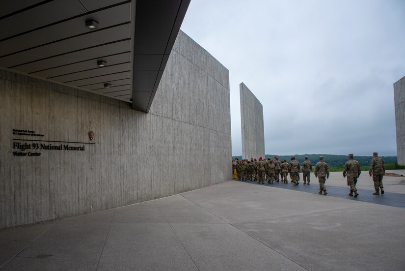 Pennsylvania Air National Guard members attending the 2021 Airman Development Program enter a portion of the Flight 93 Memorial in Stoystown, Pennsylvania, June 11, 2021. The 111th Attack Wing Rising Six Council, which is headquartered at Biddle Air National Guard Base in Horsham Pennsylvania, planned a trip to the Flight 93 Memorial as part of the professional development course designed to aid in the development of more than 50 junior-enlisted attendees from the 111th ATKW, the 171st Air Refueling Wing, and the 193rd Special Operations Wing.
