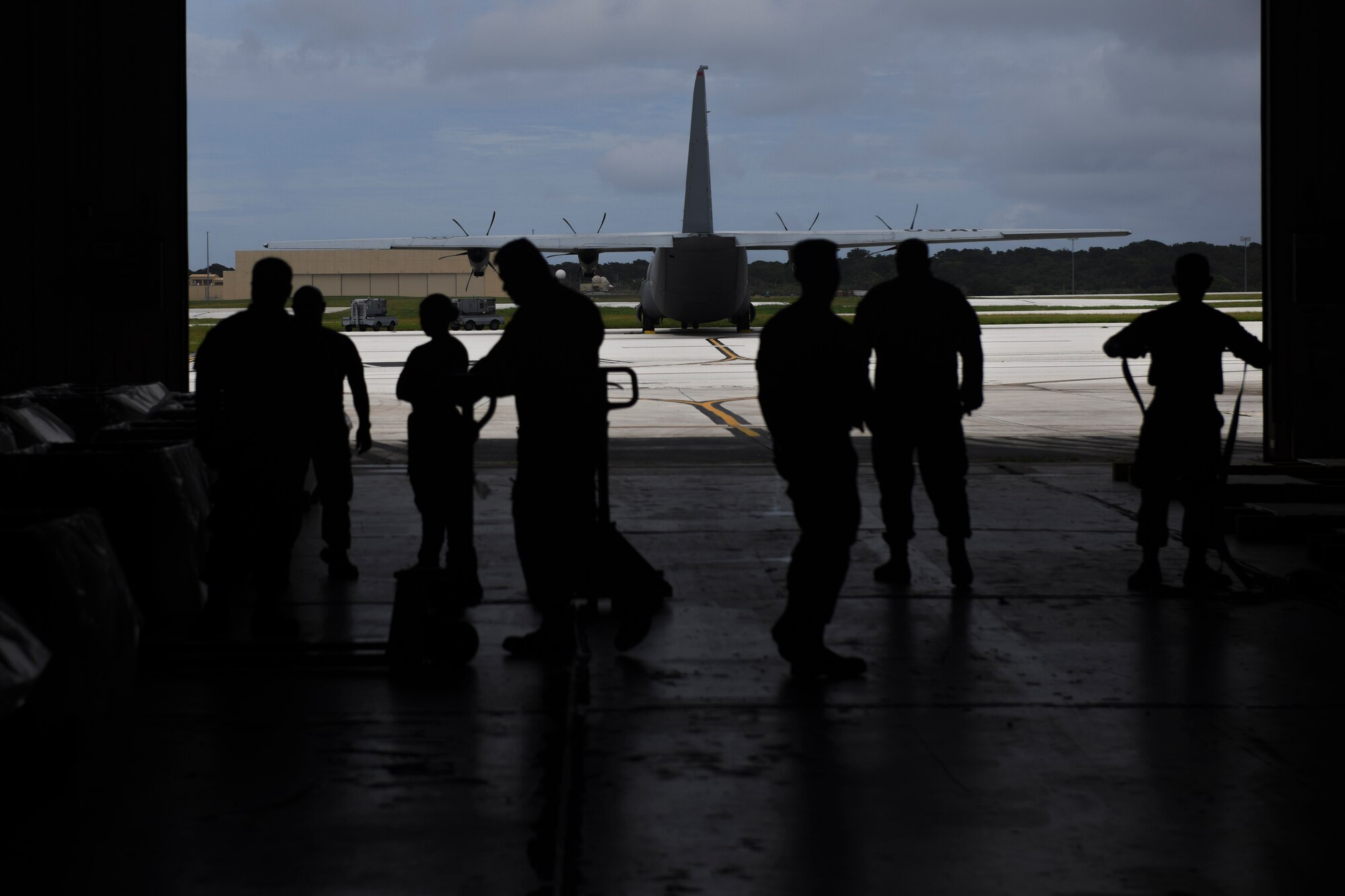Members of the 374th Airlift Wing prepare bundles during the 70th Anniversary of Operation Christmas Drop at Andersen Air Force Base, Guam, Dec. 1, 2021. OCD is the Department of Defense’s longest running humanitarian aid and disaster relief training mission and provides relief to more than 50 islands throughout the Pacific. Operations such as OCD provide the U.S. and its partners the opportunity to enhance joint operational capabilities and maintain preparedness for real world emergencies. (U.S. Air Force photo by Tech. Sgt. Joshua Edwards)