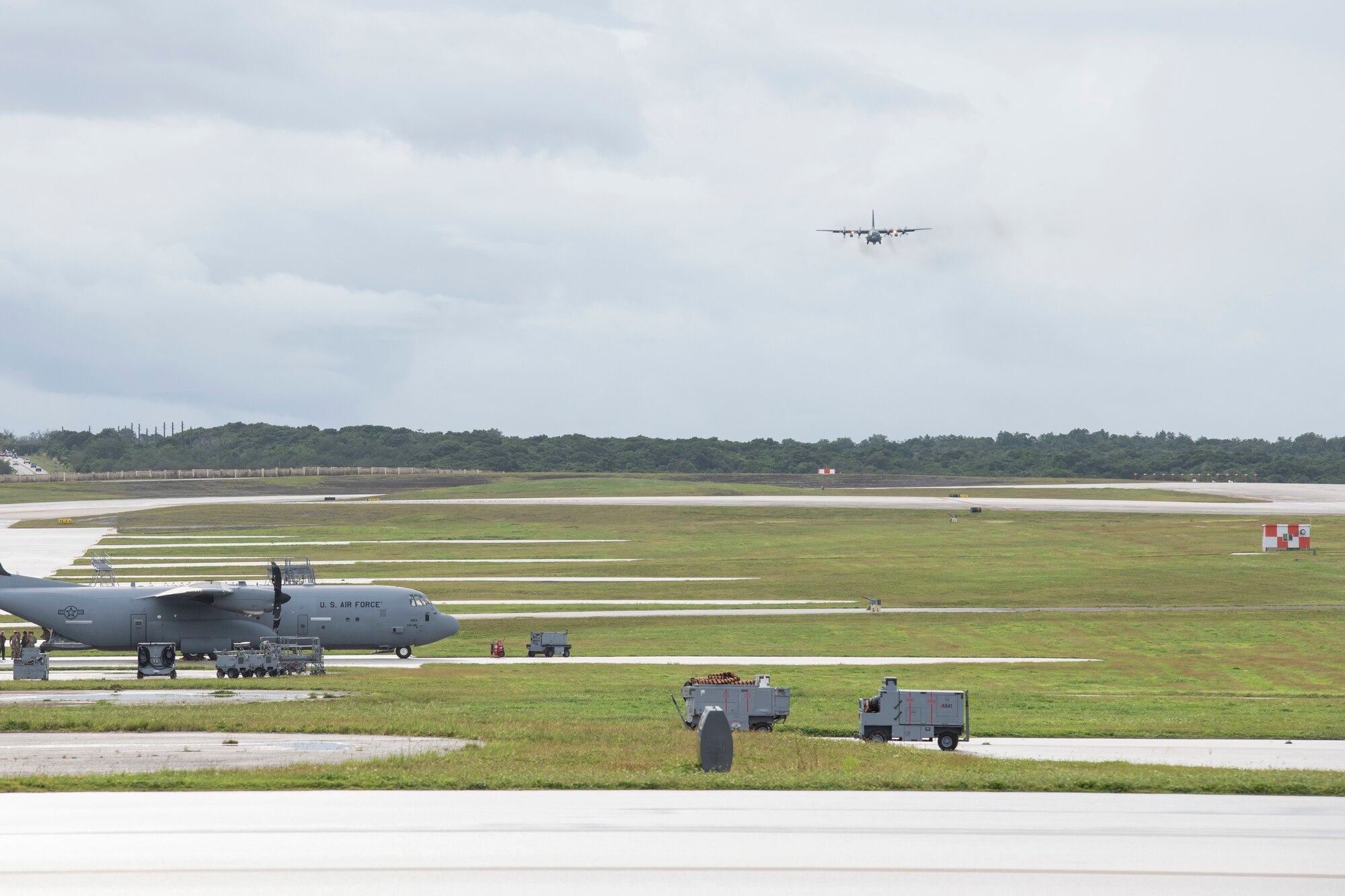 A Republic of Korea Air Force C-130H Super Hercules assigned to the 251st Airlift Squadron prepares to land at Andersen Air Force Base, Guam, Dec. 1, 2021, for the 70th Anniversary of Operation Christmas Drop. This is the first year for ROKAF to participate in OCD and will help provide food and supplies to 20,000 islanders in the Federated States of Micronesia and Republic of Palau as part of OCD to improve humanitarian assistance and disaster relief skills alongside the U.S. to enhance joint capabilities in case of real-world emergencies. (U.S. Air Force photo by Tech. Sgt. Joshua Edwards)