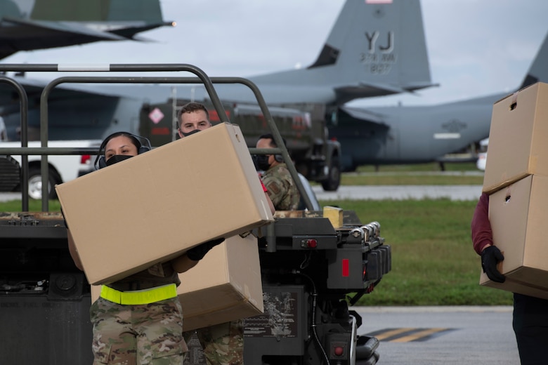 Members of the 36th Wing help unload a C-130J Super Hercules assigned to the 36th Airlift Squadron from Yokota Air Base, Japan, taxis at Andersen Air Force Base, Guam, Dec. 1, 2021, for the 70th Anniversary of Operation Christmas Drop. OCD is the Department of Defense’s longest running humanitarian aid and disaster relief training mission and provides relief to more than 50 islands throughout the Pacific. Operations such as OCD provide the U.S. and its partners the opportunity to enhance joint operational capabilities and maintain preparedness for real world emergencies. (U.S. Air Force photo by Tech. Sgt. Joshua Edwards)