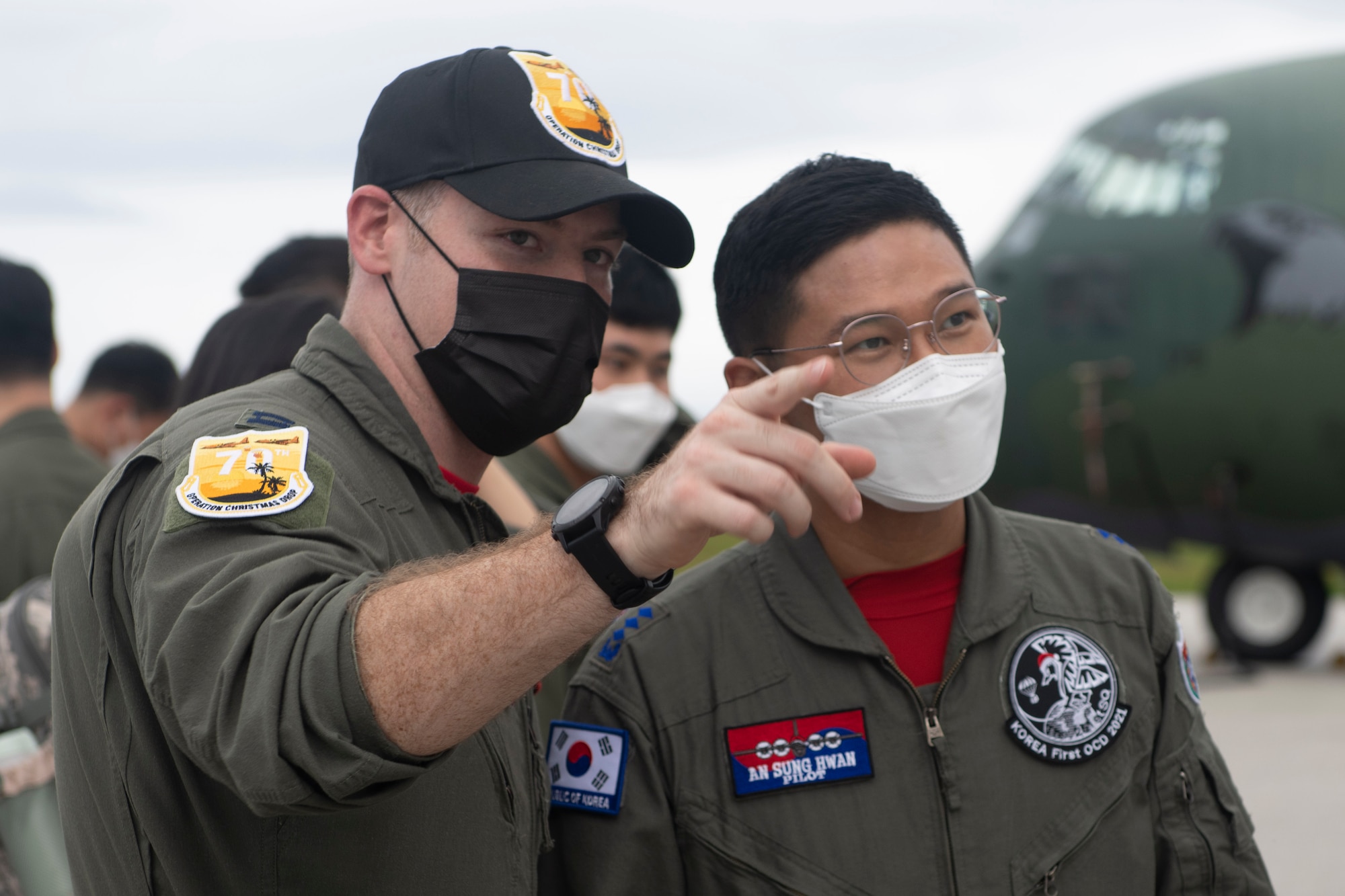U.S. Air Force Capt. Alex Randall, 36th Airlift Squadron pilot and Operation Christmas Drop mission commander, left, and Republic of Korea Air Force Capt. An Sung Hwan, 251st Airlift Squadron pilot, meet after ROKAF’s arrival to Andersen Air Force Base, Guam, Dec. 1, 2021. Both the 374th Airlift Wing and 251st AS will provide support to more 20,000 islanders in the Federated States of Micronesia and Republic of Palau, during Operation Christmas Drop. (U.S. Air Force photo by Tech. Sgt. Joshua Edwards)
