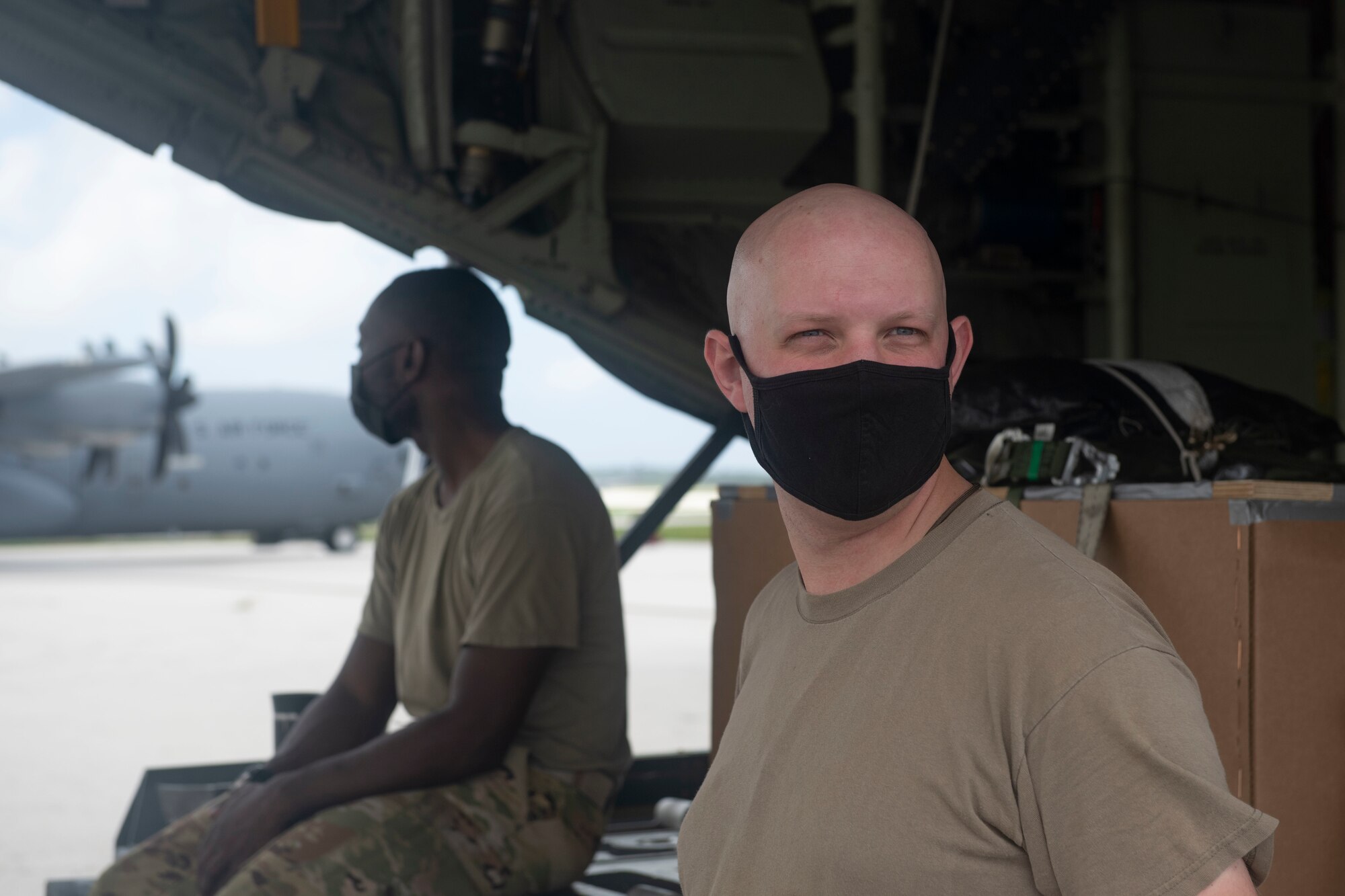Staff Sgts. Timothy Foote, right, and McArthur Posey, 36th Airlift Squadron loadmasters, wait for takeoff at Andersen Air Force Base, Guam, Dec. 2, 2021, for the 70th Anniversary of Operation Christmas Drop. OCD is the Department of Defense’s longest-running humanitarian assistance and disaster relief training mission and provides relief to more than 50 islands throughout the Pacific. Operations such as OCD provide the U.S. and its partners and allies the opportunity to enhance joint operational capabilities and maintain preparedness for real world emergencies. (U.S. Air Force photo by Tech. Sgt. Joshua Edwards)