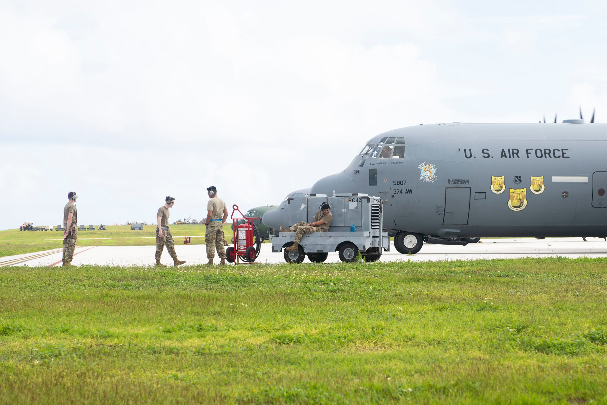 Airmen from the 374th Airlift Wing wait for takeoff at Andersen Air Force Base, Guam, Dec. 2, 2021, for the 70th Anniversary of Operation Christmas Drop. OCD is the Department of Defense’s longest-running humanitarian assistance and disaster relief training mission and provides relief to more than 50 islands throughout the Pacific. Operations such as OCD provide the U.S. and its partners and allies the opportunity to enhance joint operational capabilities and maintain preparedness for real world emergencies. (U.S. Air Force photo by Tech. Sgt. Joshua Edwards)