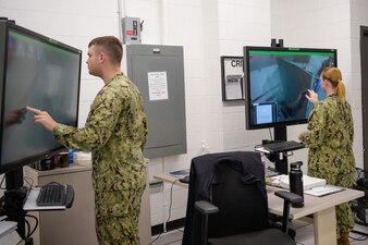 Cryptologic Technician Technical students practice maintenance skills for the AN/SLQ-32(V)6 on a Multipurpose Reconfigurable Training System (MRTS) 3D trainers at Information Warfare Training Center Corry Station, Dec. 2, 2021.
