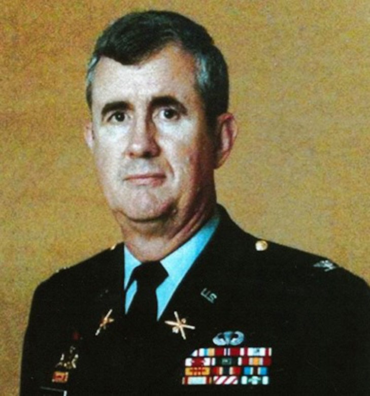 A man in dress uniform poses for the camera.