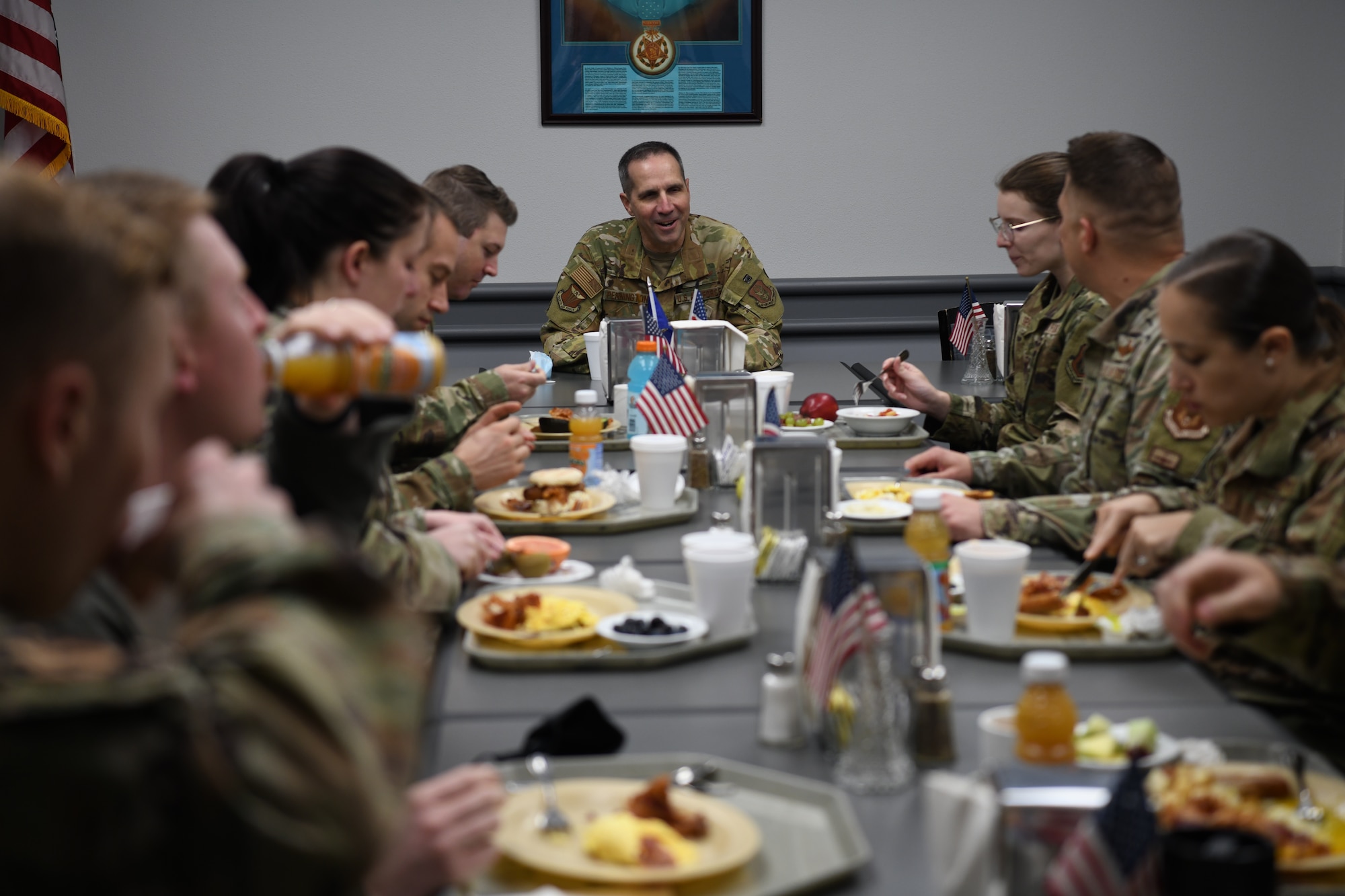 Maj. Gen. Jeffrey T. Pennington, 4th Air Force commander, speaks to 445th Airlift Wing Reserve Citizen Airmen during breakfast at the Wright-Patterson Air Force Base Pitsenbarger Dining Facility Nov. 6, 2021.