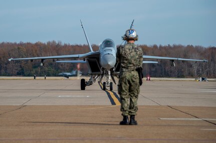 Cmdr. Erin E. Flint, commanding officer of Strike Fighter Squadron (VFA) 131, parks on the flight line during an aerial change of command