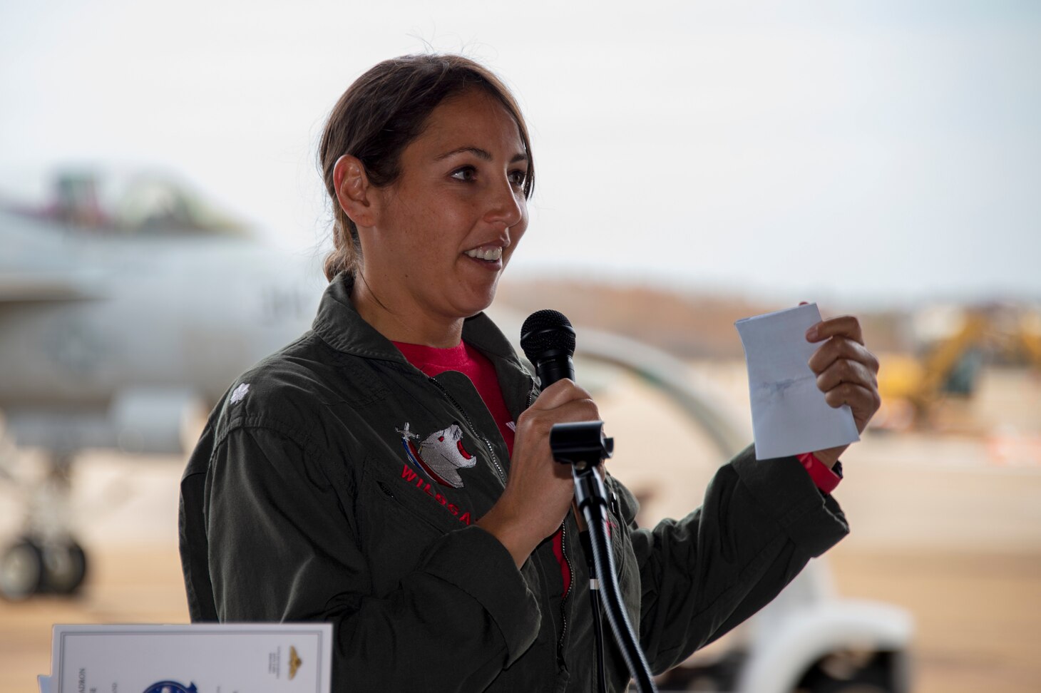 Cmdr. Erin E. Flint, commanding officer of Strike Fighter Squadron (VFA) 131, gives remarks