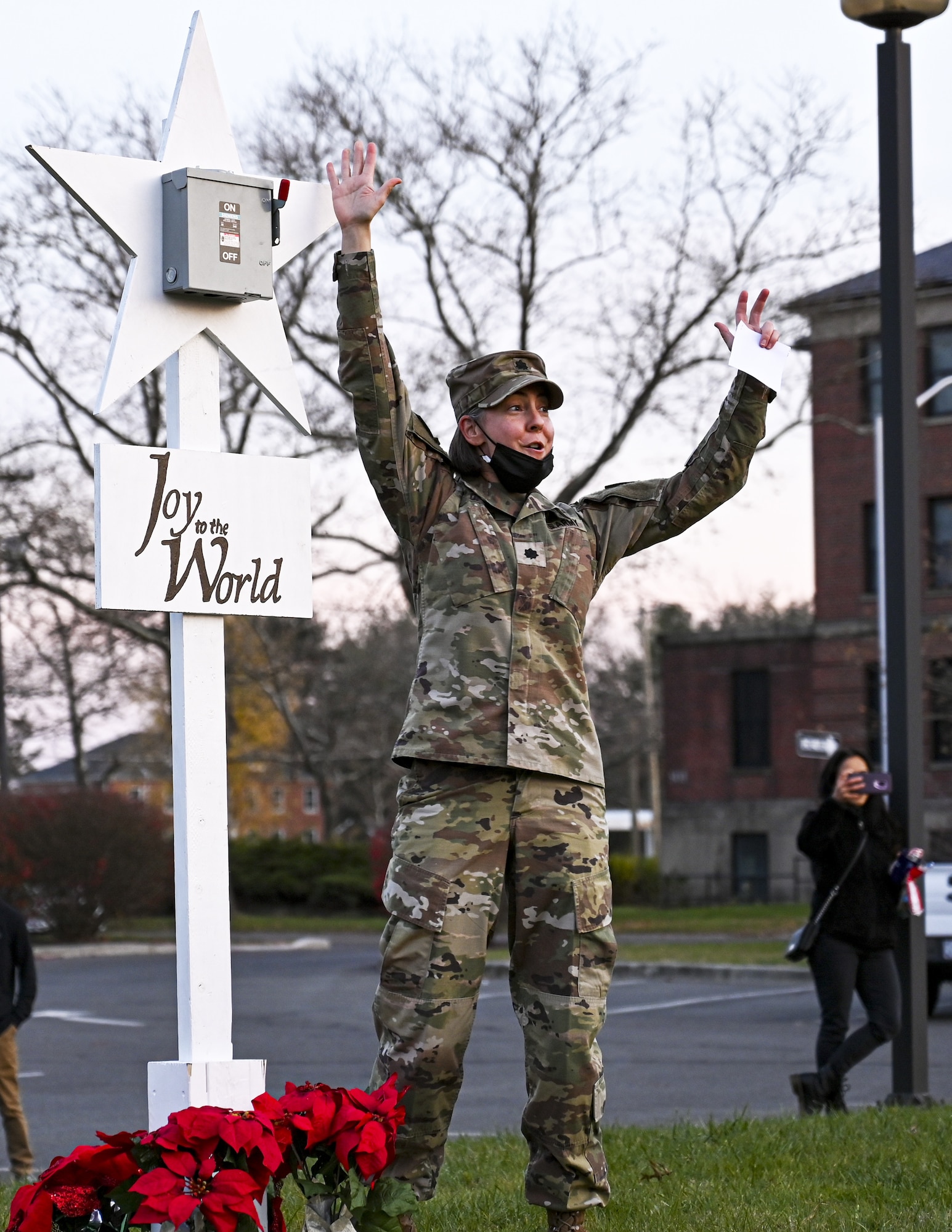 U.S. Army LTC Dawn M. Opland, deputy commander Army Support Activity Dix, lights the tree during the Christmas Tree Lighting Ceremony held at Wurman Hall on Army Support Activity, N.J., Dec 1, 2021. Opland played a critical role in overseeing the planning and success of the event and was given the honor of lighting the tree as a result by the JB MDL Installation Commander. The annual tradition attended by leadership and JB MDL families offered horse-drawn carriage rides, hot chocolate, cookies, funnel cake, pretzels, kettle corn and a special visit from the North Pole. (U.S. Air Force photo by SrA Matt Porter)