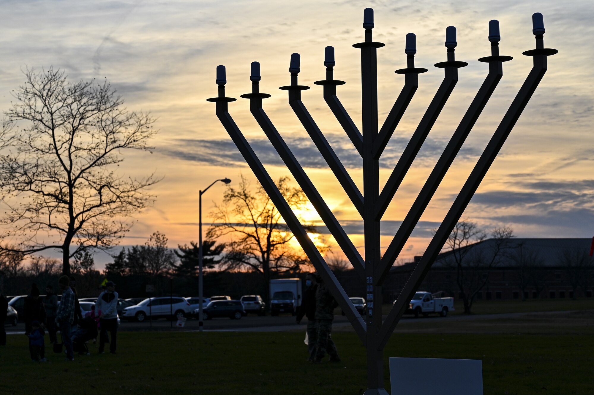 A large menorah is displayed for decoration during the Christmas Tree Lighting Ceremony held at Wurman Hall on Army Support Activity Dix, N.J., Dec 1, 2021. The annual tradition attended by leadership and JB MDL families offered horse-drawn carriage rides, hot chocolate, cookies, funnel cake, pretzels, kettle corn and a special visit from the North Pole. (U.S. Air Force photo by SrA Matt Porter)