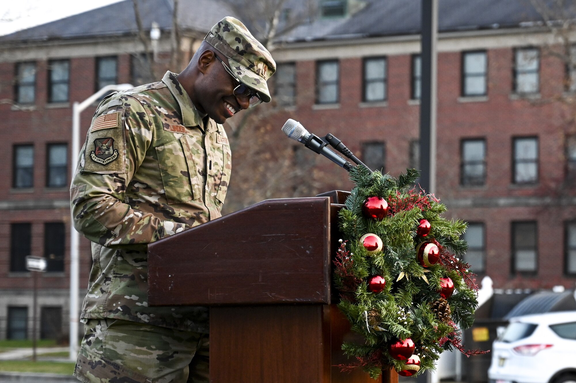 U.S. Air Force Chaplain Tarvick Linder provides an opening address and prayer during the Christmas Tree Lighting Ceremony held at Wurman Hall on Army Support Activity Dix, N.J., Dec 1, 2021. The annual tradition attended by leadership and JB MDL families offered horse-drawn carriage rides, hot chocolate, cookies, funnel cake, pretzels, kettle corn and a special visit from the North Pole. (U.S. Air Force photo by SrA Matt Porter)
