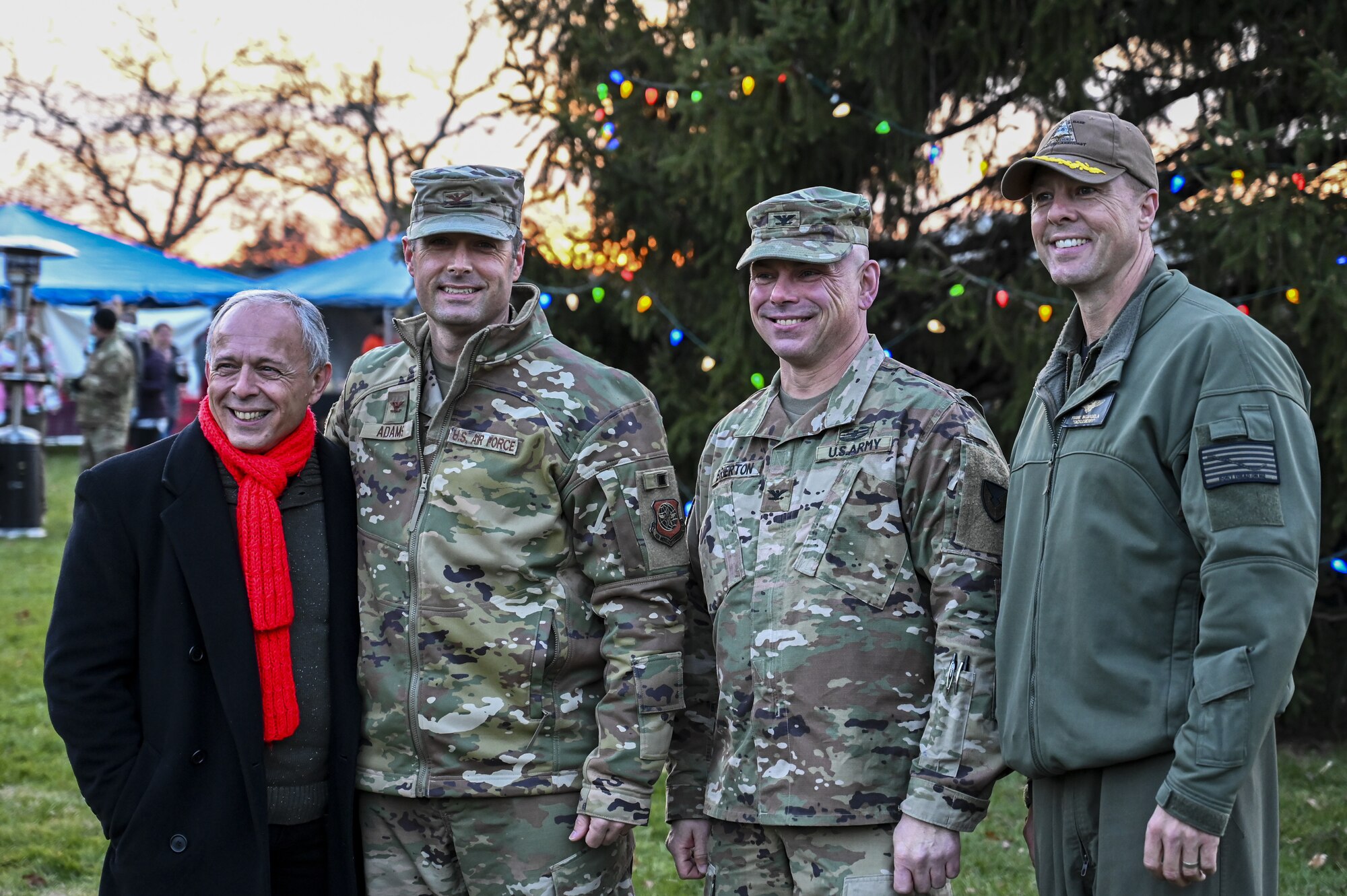 Joint Base McGuire-Dix-Lakehurst Senior Leadership pose for a photo during the Christmas Tree Lighting Ceremony held at Wurman Hall on Army Support Activity Dix, N.J., Dec 1, 2021. The annual tradition attended by leadership and JB MDL families offered horse-drawn carriage rides, hot chocolate, cookies, funnel cake, pretzels, kettle corn and a special visit from the North Pole. (U.S. Air Force photo by SrA Matt Porter)