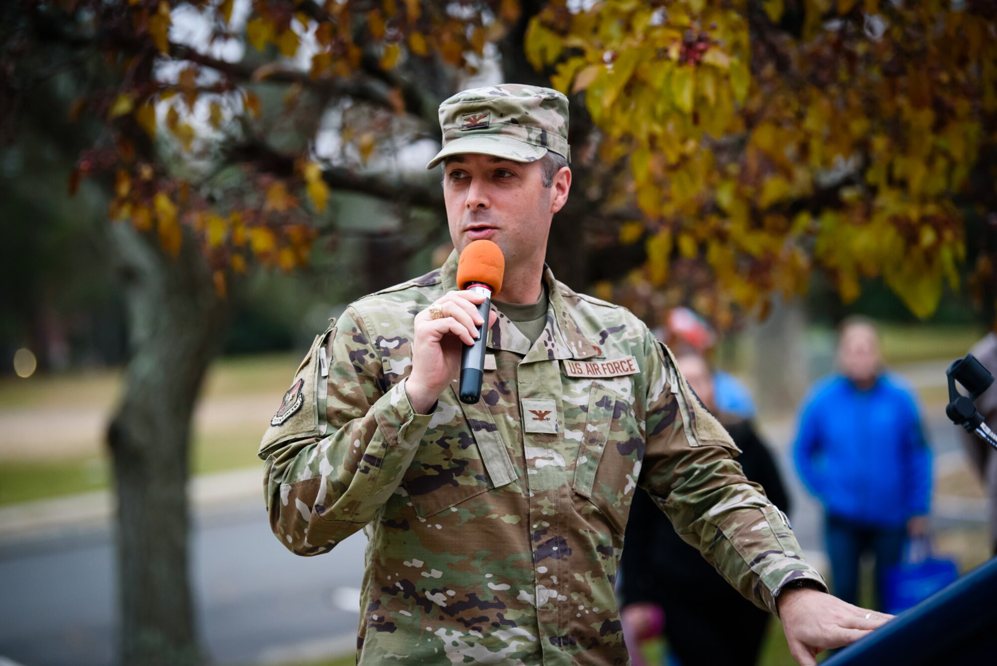 Colonel Wes Adams, Joint Base McGuire-Dix-Lakehurst N.J. and the 87th Air Base Wing Commander, gives season’s greetings at the Holiday Tree Lighting Ceremony December 2, 2021 at building 120. The annual tradition attended by leadership and JB MDL families offered horse & carriage rides, hot chocolate, cookies, funnel cake, pretzels, kettle corn and a special visit from the North Pole! (U.S. Navy photo by Russ Meseroll)