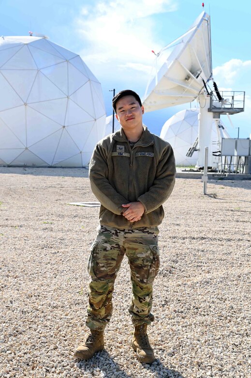 U.S. Space Force Sgt. David Kim, assigned to the 7th Reconnaissance Squadron, stands in front of his work site, Europe 3, a satellite communications facility at Naval Air Station Sigonella, Nov. 23, 2021. NAS Sigonella’s strategic location enables U.S., allied, and partner nation forces to deploy and respond as required, ensuring security and stability in Europe, Africa and Central Command.