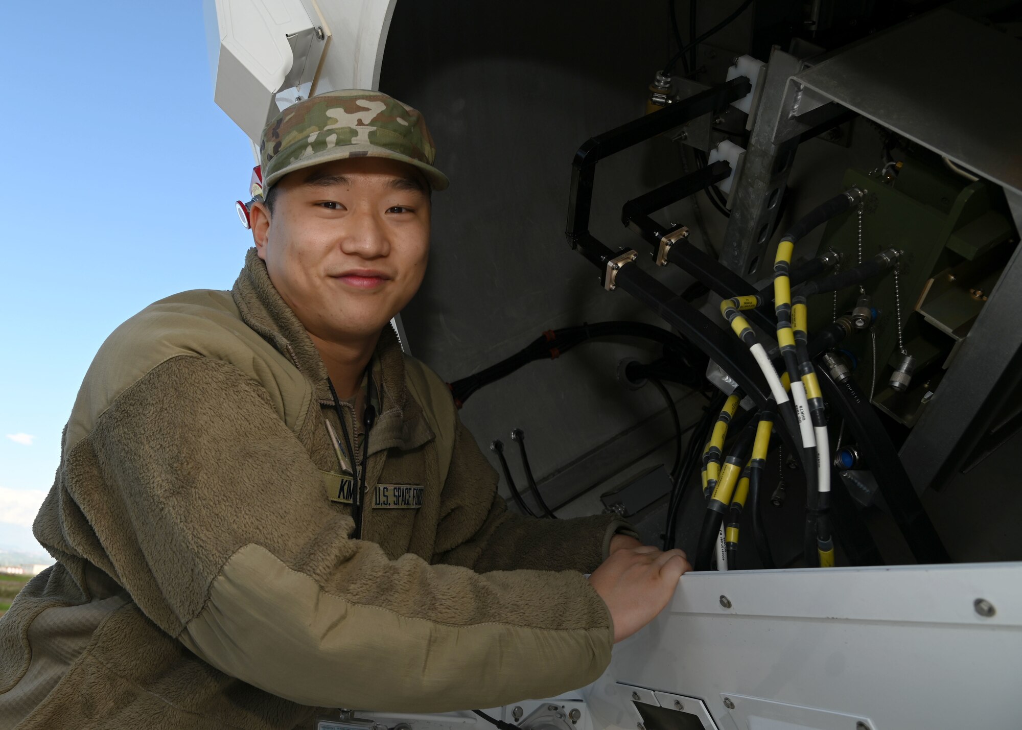 U.S. Space Force Sgt. David Kim, assigned to the 7th Reconnaissance Squadron, poses for a photo before returning to conducting maintenance on a satellite onboard Naval Air Station Sigonella, Nov. 23, 2021. NAS Sigonella’s strategic location enables U.S., allied, and partner nation forces to deploy and respond as required, ensuring security and stability in Europe, Africa and Central Command.