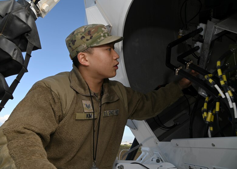 U.S. Space Force Sgt. David Kim, assigned to the 7th Reconnaissance Squadron, conducts maintenance on a satellite onboard Naval Air Station Sigonella, Nov. 23, 2021. NAS Sigonella’s strategic location enables U.S., allied, and partner nation forces to deploy and respond as required, ensuring security and stability in Europe, Africa and Central Command.