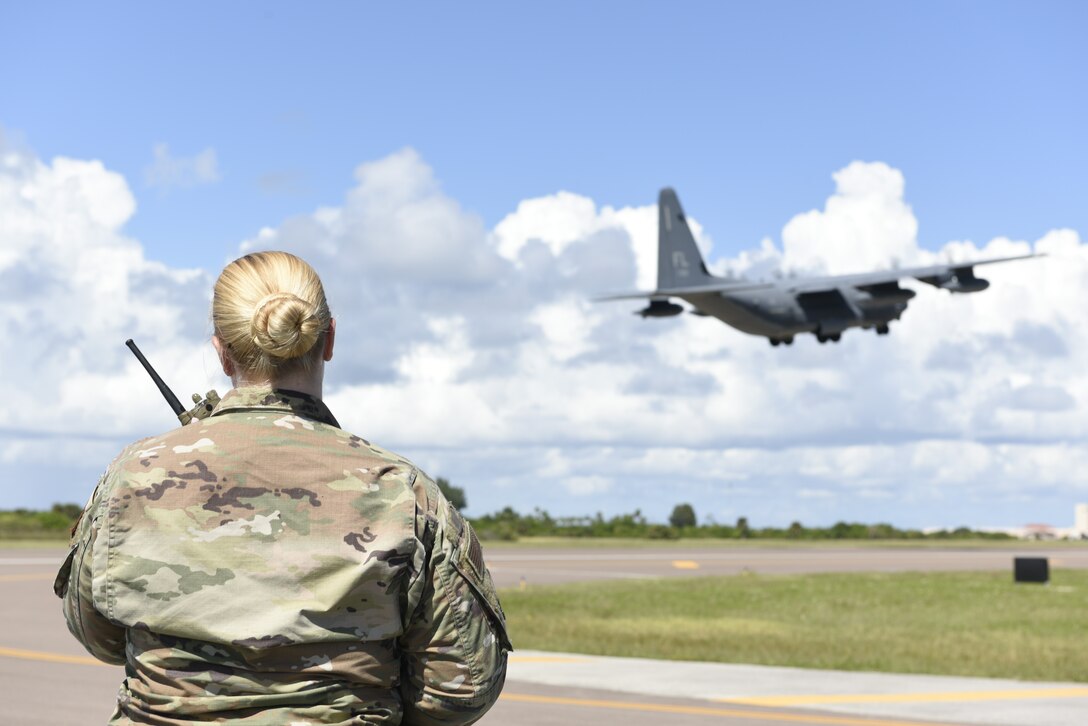 Tech. Sgt. Marlena Bledsoe, 45th LRS noncommissioned officer in charge of airfield management training, Radios into the Air Traffic Control Tower on Oct. 12, 2021 at Patrick Space Force Base. With traffic on the flightline, airfield management stays in contact with the tower to maintain safety. (U.S. Space Force Photo by Airman 1st Class Samuel Becker)