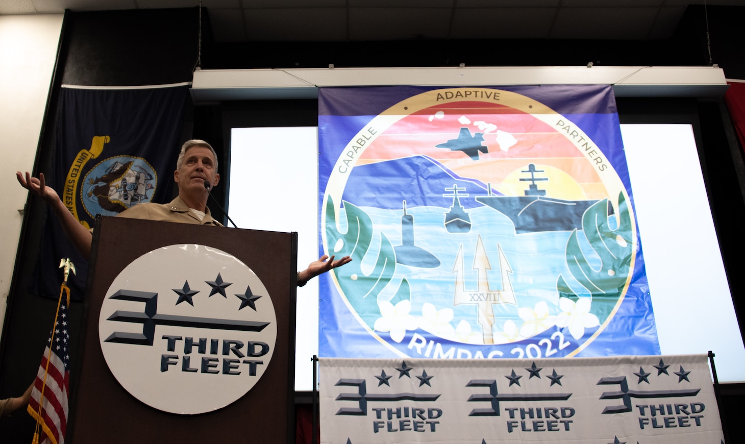 SAN DIEGO (November 30, 2021) Vice Adm. Steve Koehler, commander, U.S. 3rd Fleet, reveals the official Exercise Rim of the Pacific (RIMPAC) 2022 logo during the RIMPAC 2022 mid-planning conference (MPC) at Naval Base Point Loma, Nov. 30. Participants from all countries scheduled for RIMPAC 2022 are in attendance at the weeklong conference that affords attendees the opportunity to share information and integrate planning efforts. (U.S. Navy photo by Mass Communication Specialist 1st Class David Mora Jr.)