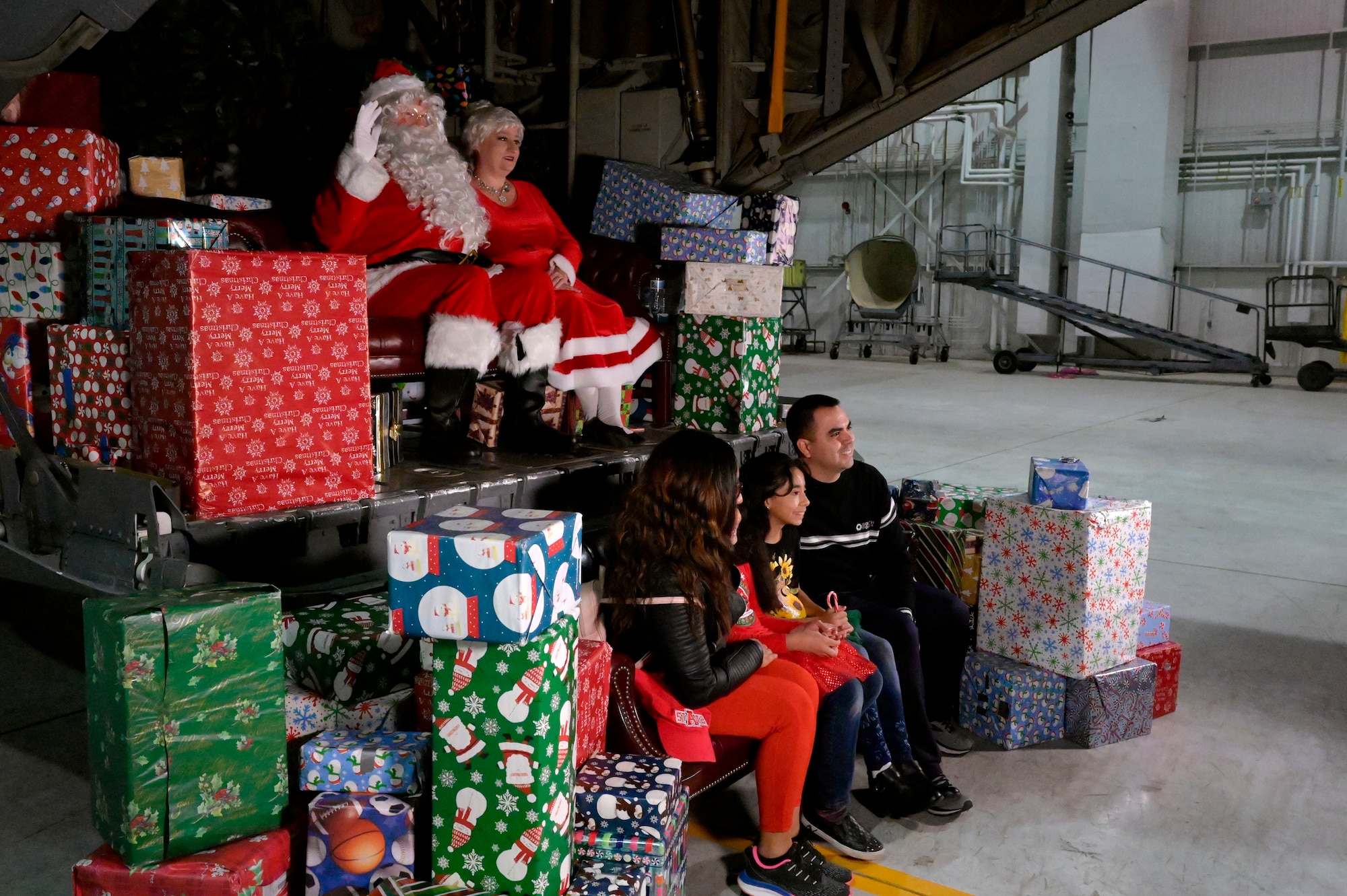 A family poses for a photo with Santa Claus