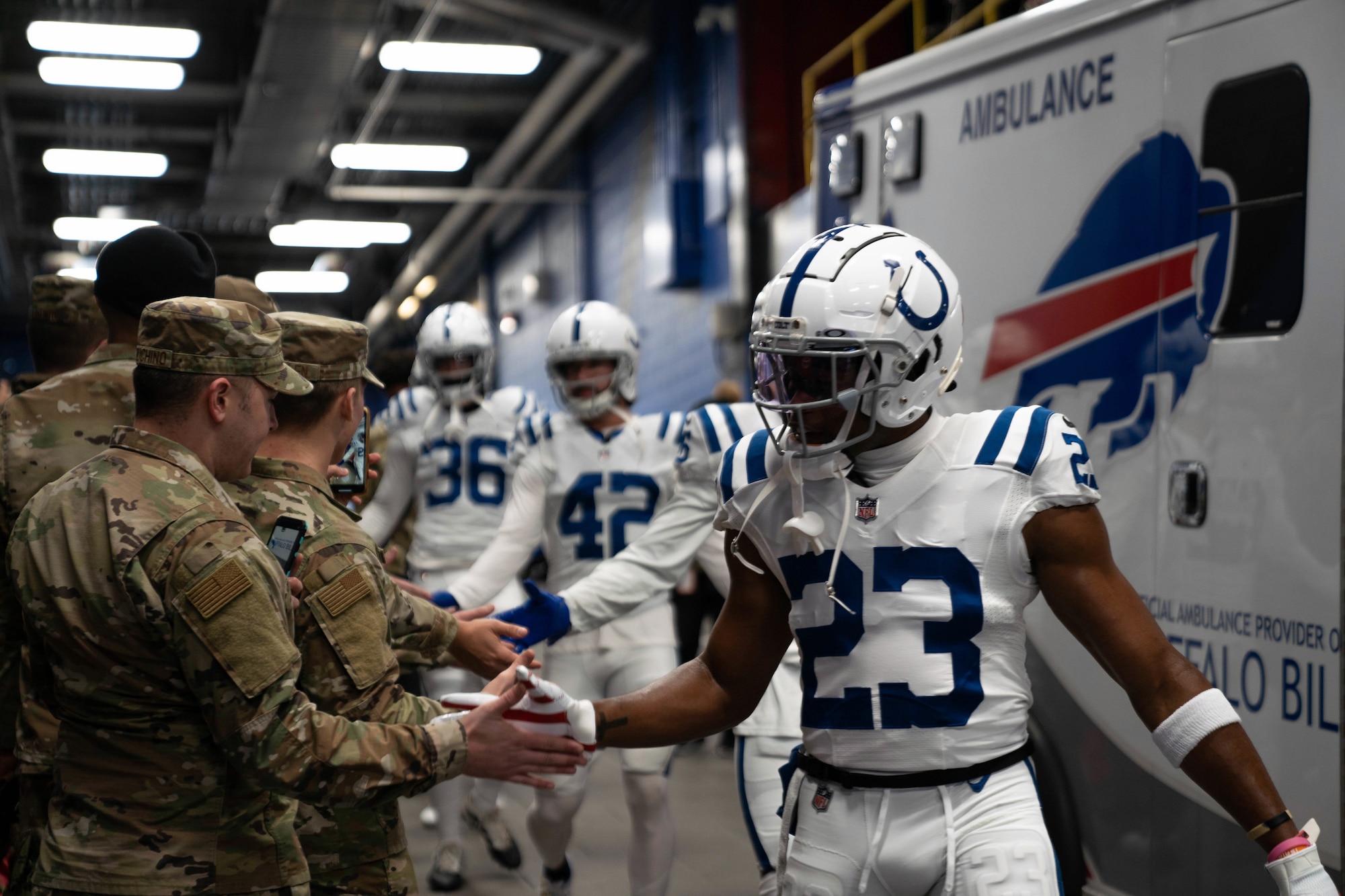 Airmen greet members of the NFL’s Indianapolis Colts