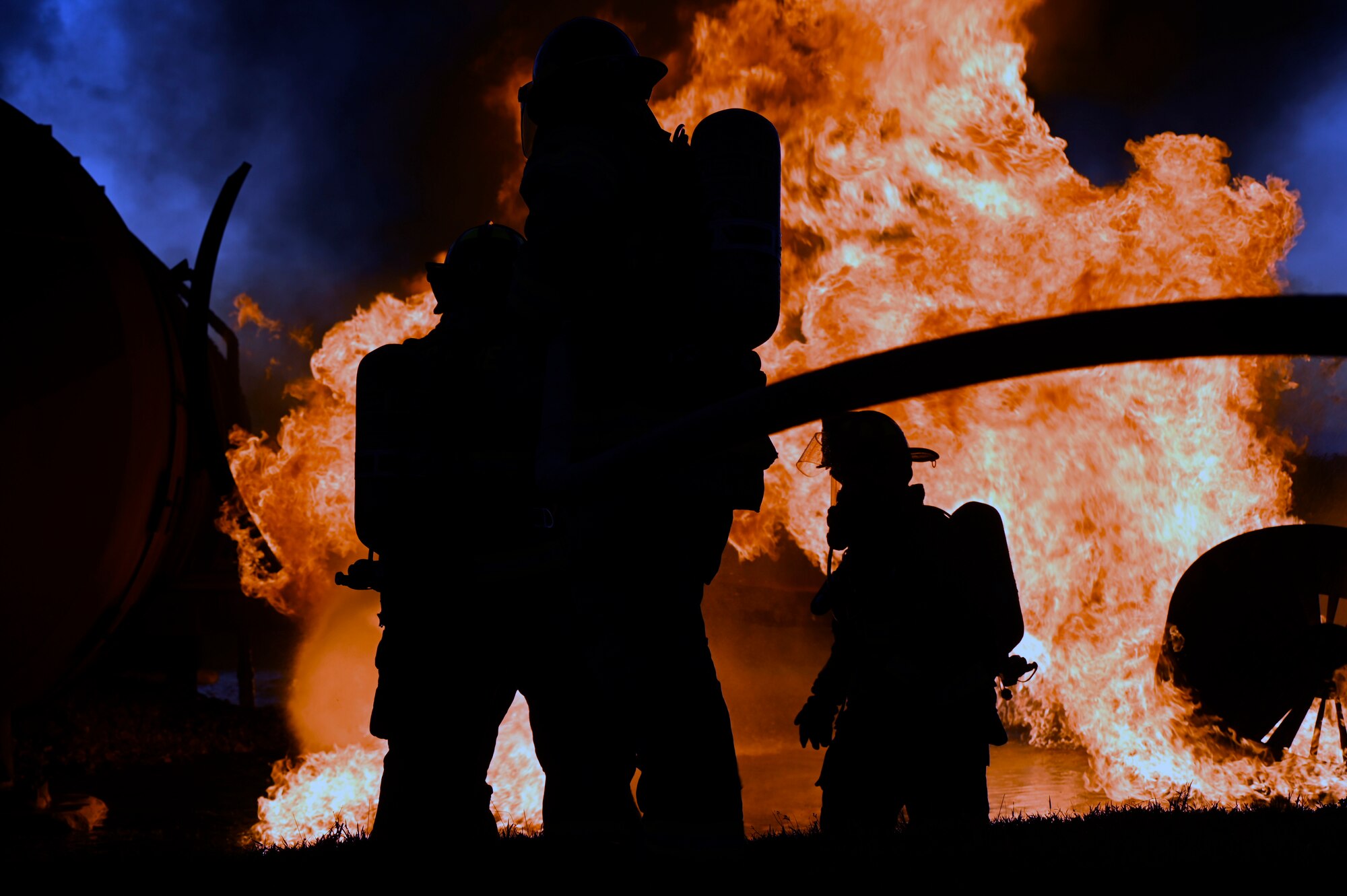 Airmen extinguish a simulated aircraft fire