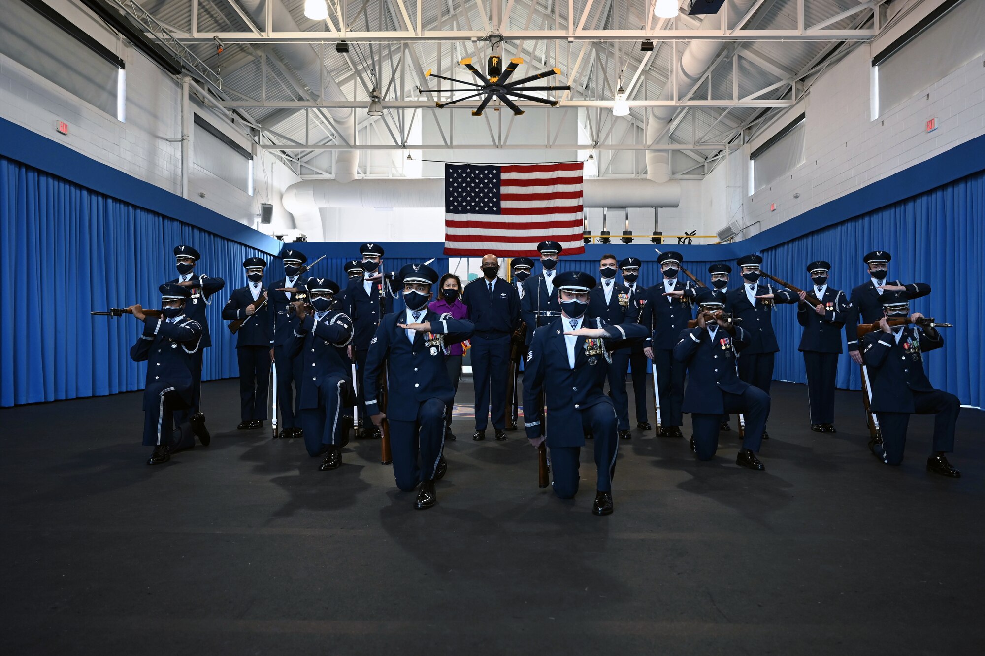 Gen. CQ Brown, Jr. and his wife, Sharene, pose with the U.S. Air Force Honor Guard Drill Team