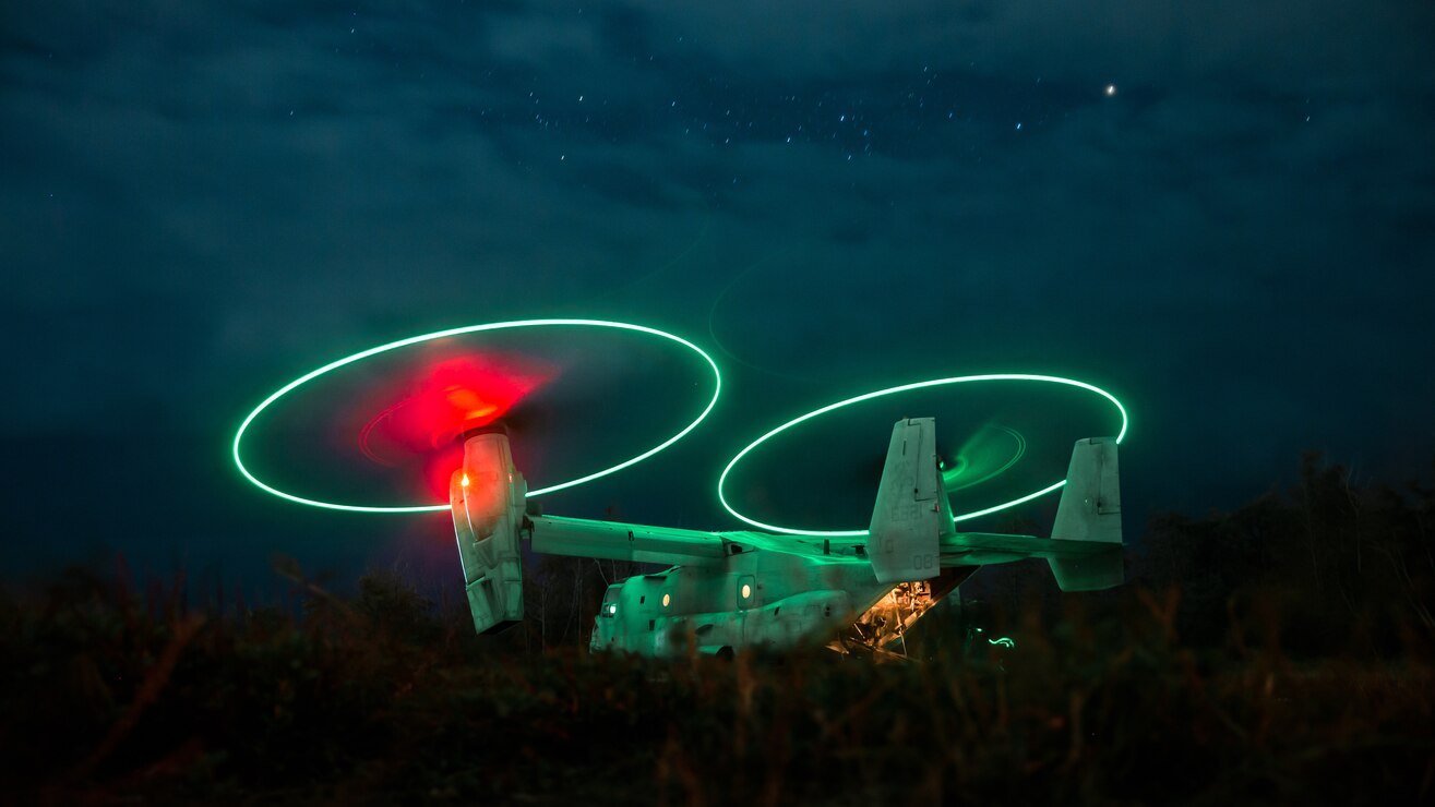 U.S. Service Members with 3d Battalion, 3d Marines and 2nd Squadron, 14th Cavalry Regiment, embark an MV-22 Osprey with Marine Medium Tiltrotor Squadron 268, Marine Aircraft Group 24 on Marine Corps Training Area Bellows, Hawaii, Nov. 30, 2021. Marines with 3/3 conducted a joint training exercise simulating realistic air-assault and urban operations in strategic island terrain with MAG-24 and 2/14.