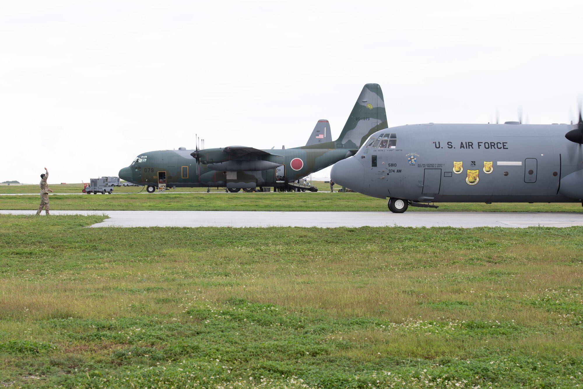 A C-130J Super Hercules assigned to the 36th Airlift Squadron from Yokota Air Base, Japan, prepares to park at Andersen Air Force Base, Guam, Dec. 1, 2021, prior to the 70th Anniversary of Operation Christmas Drop. This year, alongside its mission partners and allies, the 374th Airlift Wing plans to airdrop more than 180 packages containing food and supplies to over 20,000 islanders in the Federated States of Micronesia and Republic of Palau. (U.S. Air Force photo by Tech. Sgt. Joshua Edwards)
