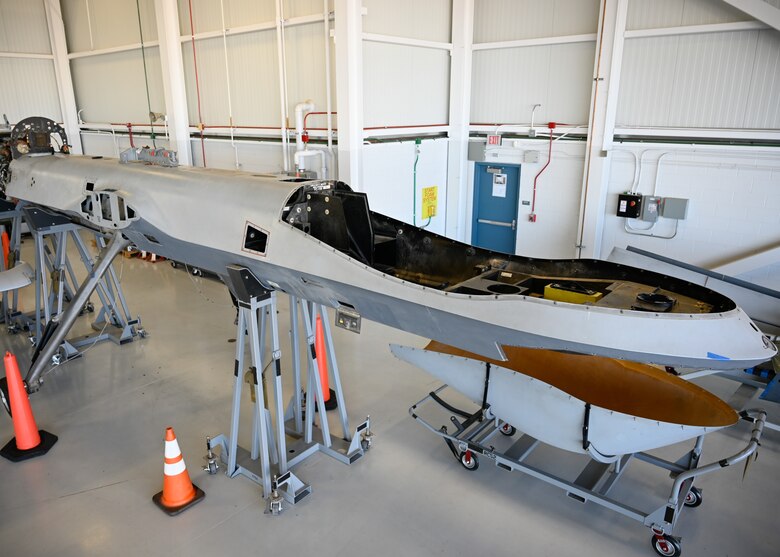 A gutted and disassembled MQ-9 Reaper sits in a hangar at Libby Army Airfield in Ft. Huachuca, Ariz. The aircraft awaits reassembly by 214 LRE Avionics Technicians in support of the active duty Air Force as a Systems Integration Lab (SIL), providing a unique training opportunity for the maintenance personnel Air Force-wide who work on the Reaper aircraft.