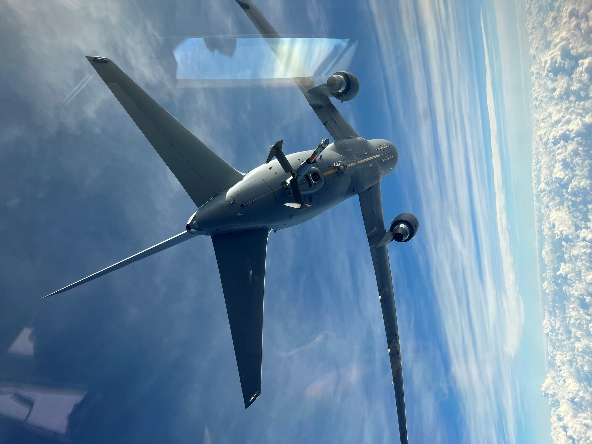 A KC-46 Pegasus crewed by the 78th Air Refueling Squadron, 514th Air Mobility Wing, Joint Base McGuire-Dix-Lakehurst, N.J., flies over the Atlantic Ocean to refuel a KC-10, also crewed by the 78th ARS, December 4, 2021.