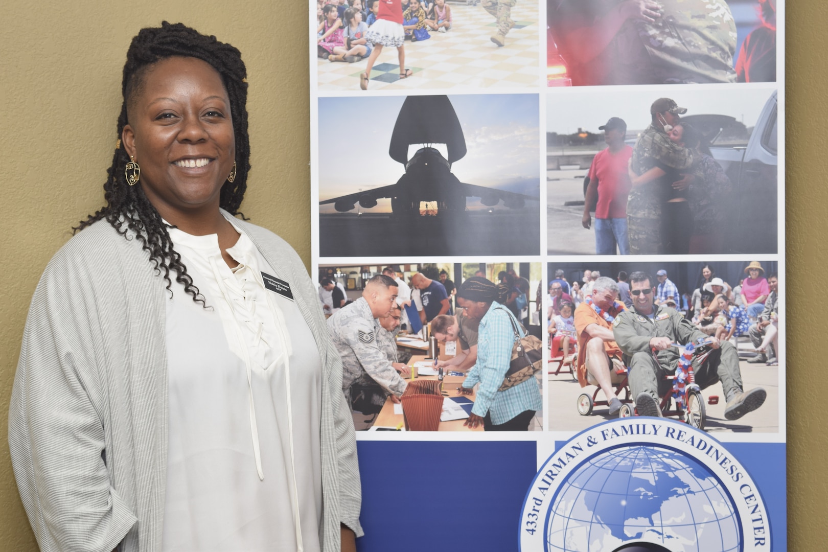 Nakia Evans discusses her role as accredited personal financial counselor at the 433rd Airlift Wing Airman and Family Readiness Center on Joint Base San Antonio-Lackland, Texas, Dec. 4, 2021. Personal financial counselors provide financial education and advising at no-cost for military members. (U.S. Air Force photo by Senior Airman Brittany Wich)