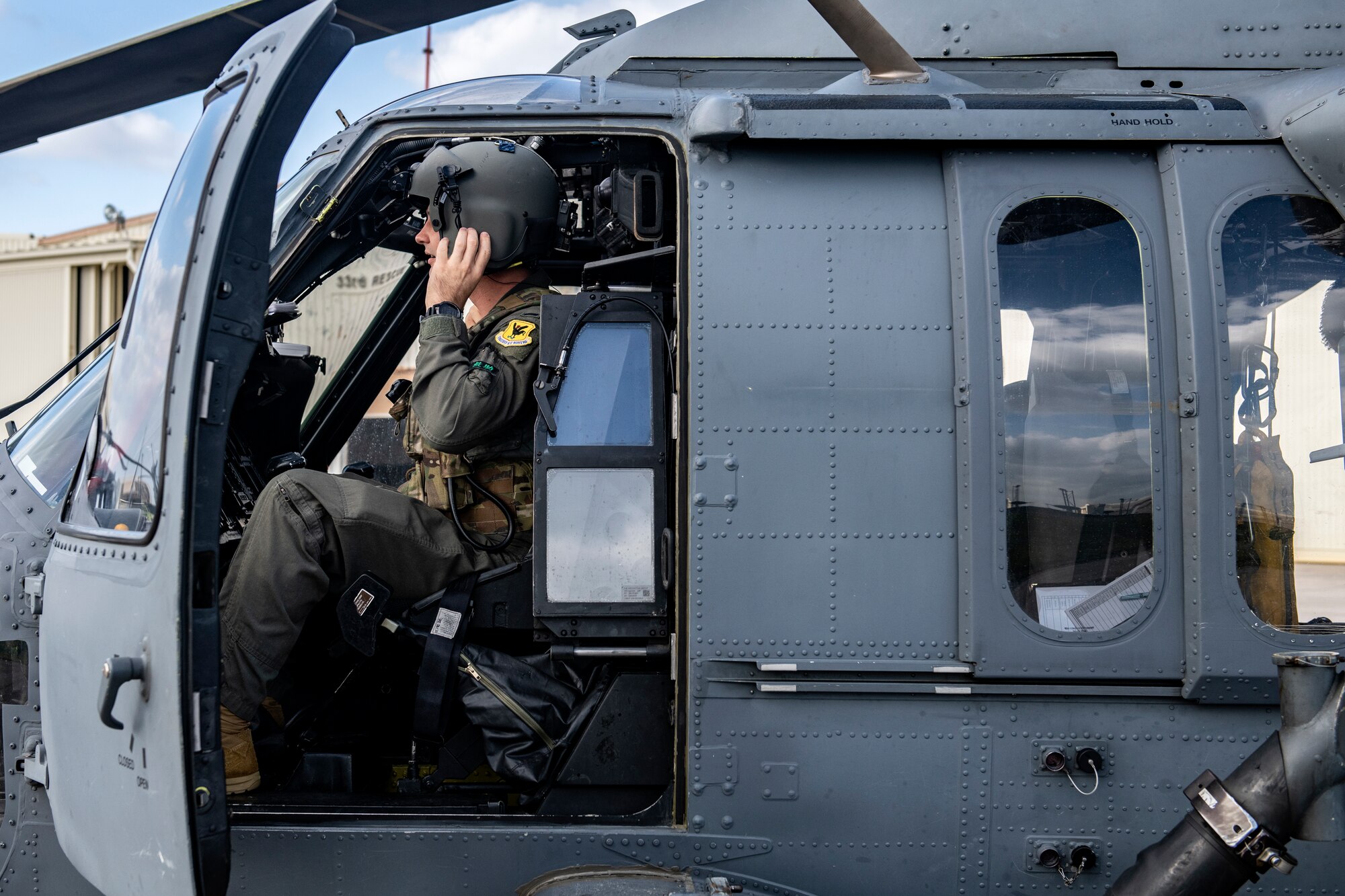 U.S Air Force 1st Lt. Trent Badger, 33rd Rescue Squadron co-pilot, boards an HH-60G Pave Hawk for a training flight at Kadena Air Base, Japan, Dec. 1, 2021. The 33rd RQS provides a reliable combat search and rescue platform to aid in exercises and real-world operations in the Indo-Pacific region. (U.S. Air Force photo by Senior Airman Jessi Monte)