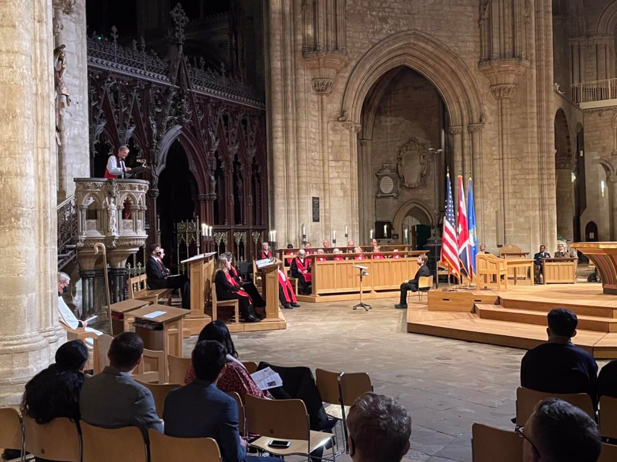 U.S. Air Force Col. Gene Jacobus, 100th Air Refueling Wing commander, introduces Rt. Rev. Dr. Dagmar Winter, the Bishop of Huntingdon, the guest speaker, at a Thanksgiving Eve Service at the Ely Cathedral, Ely, England, Nov. 24, 2021. The 35th annual service provided the local American and English community an opportunity to celebrate the American holiday together. (U.S. Air Force photo by Airman 1st Class Viviam Chiu).