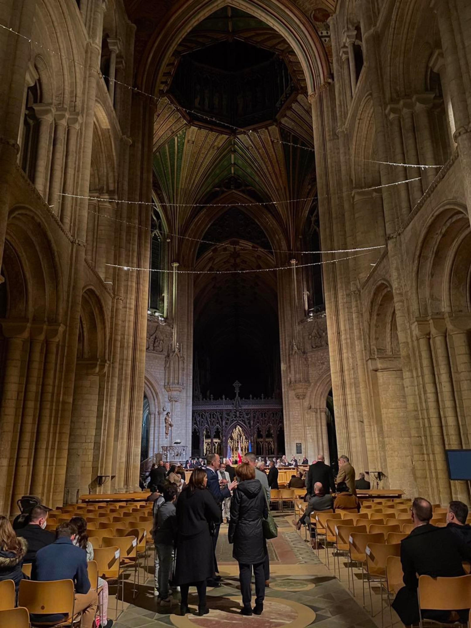 U.S. Air Force Col. Gene Jacobus, 100th Air Refueling Wing commander, introduces Rt. Rev. Dr. Dagmar Winter, the Bishop of Huntingdon, the guest speaker, at a Thanksgiving Eve Service at the Ely Cathedral, Ely, England, Nov. 24, 2021. The 35th annual service provided the local American and English community an opportunity to celebrate the American holiday together. (U.S. Air Force photo by Airman 1st Class Viviam Chiu).