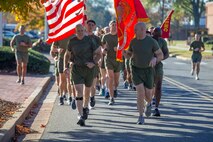 U.S. Marine Gen. David H. Berger, the 38th Commandant of the Marine Corps, and Sgt. Maj. Troy E. Black, the 19th Sergeant Major of the Marine Corps, lead a Headquarters Marine Corps formation run to the Marine Corps War Memorial in Arlington, Virginia, Nov. 9, 2021. The run was conducted in honor of the 246th Marine Corps birthday. A formation run is a traditional way units across the Marine Corps can celebrate the Marine Corps in addition to the cake cutting ceremony. (U.S. Marine Corps photo by Sgt. Victoria Ross)