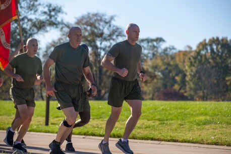 U.S. Marine Gen. David H. Berger, the 38th Commandant of the Marine Corps, and Sgt. Maj. Troy E. Black, the 19th Sergeant Major of the Marine Corps, lead a Headquarters Marine Corps formation run to the Marine Corps War Memorial in Arlington, Virginia, Nov. 9, 2021. The run was conducted in honor of the 246th Marine Corps birthday. A formation run is a traditional way units across the Marine Corps can celebrate the Marine Corps in addition to the cake cutting ceremony. (U.S. Marine Corps photo by Sgt. Victoria Ross)