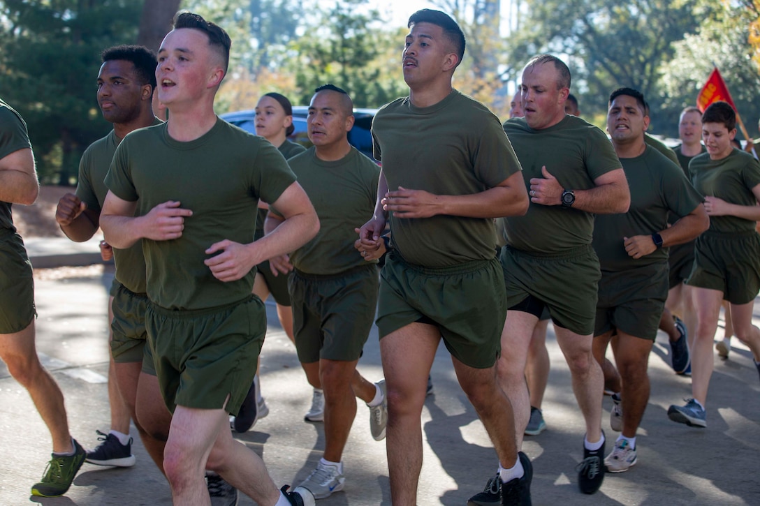 U.S. Marines with Headquarters Marine Corps and Headquarters Service Support Battalion participate in a formation run to the Marine Corps War Memorial in Arlington, Virginia, Nov. 9, 2021. The run was conducted in honor of the 246th Marine Corps birthday. A formation run is a traditional way units across the Marine Corps can celebrate the Marine Corps in addition to the cake cutting ceremony. (U.S. Marine Corps photo by Sgt. Victoria Ross)