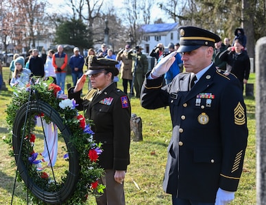 New York Army National Guard Brig. Gen. Isabel Rivera Smith, left, and Sgt. Major Jeff Colling, salute after presenting a wreath from President Joseph Biden at the gravesite of the nation’s eighth president, Martin Van Buren, in Kinderhook, New York, on his 239th birthday, Sunday, Dec. 5, 2021.