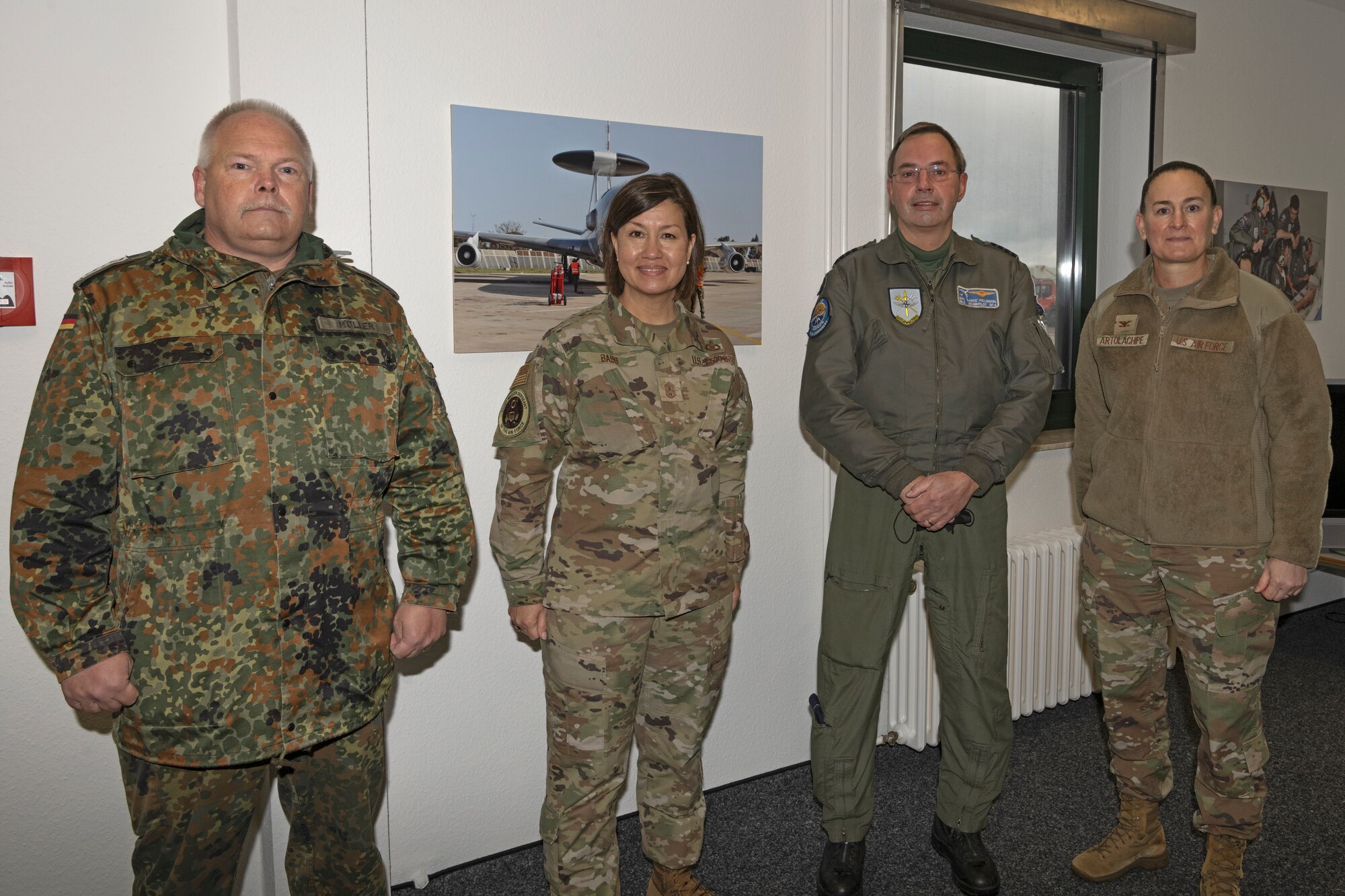 (From left) German air force Chief Master Sgt. Michael Moeller, command senior enlisted leader for NATO Early Warning and Control Force E-3A component, Chief Master Sgt. of the Air Force JoAnne S. Bass, Royal Netherlands air force Col. Sebastian ‘Bas’ Pellemans, Deputy Commander of the NAEW&C Force E-3A Component, and U.S. Air Force Col. Michelle Artolachipe, USAF Airborne Warning and Control System group commander, pose for a photo Dec. 2, 2021, on Geilenkirchen Air Base, Germany. While meeting with Airmen, Bass highlighted several Saber Nation superior performers, recognizing them for their contributions to the mission of the 52nd Fighter Wing. (U.S. Air Force photo by Tech. Sgt. Anthony Plyler)