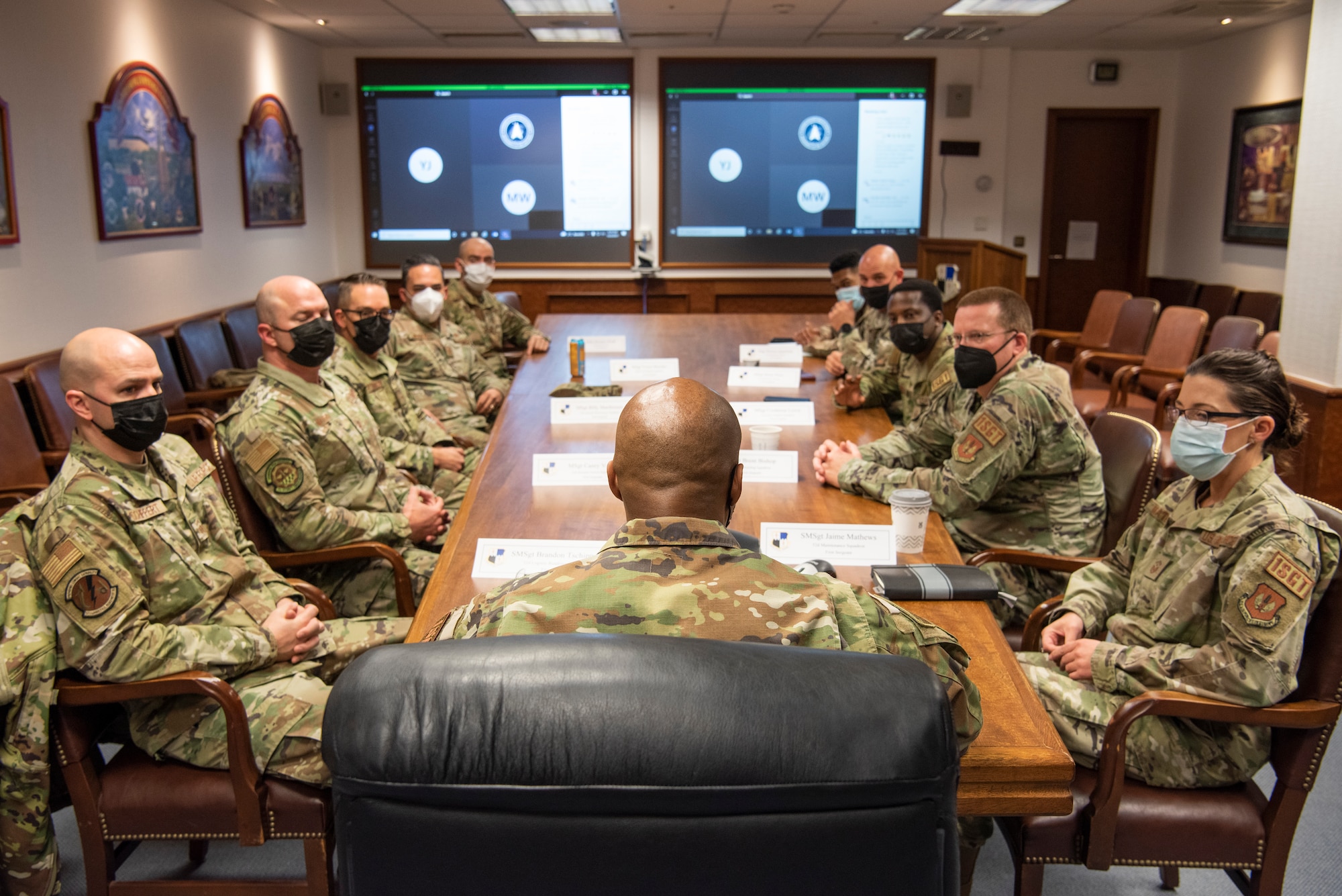 U.S. Air Force Chief Master Sgt. Mike Perry, Air Force first sergeant special duty manager, center, gives mentorship to 52nd Fighter Wing first sergeants in a conference room, Dec. 2, 2021, on Spangdahlem Air Base, Germany. Perry has served in a variety of leadership positions at the squadron, group, and MAJCOM levels. His duties have included tours as a first sergeant, group superintendent, and MAJCOM functional manager. (U.S. Air Force photo by Airman 1st Class Marcus Hardy-Bannerman)